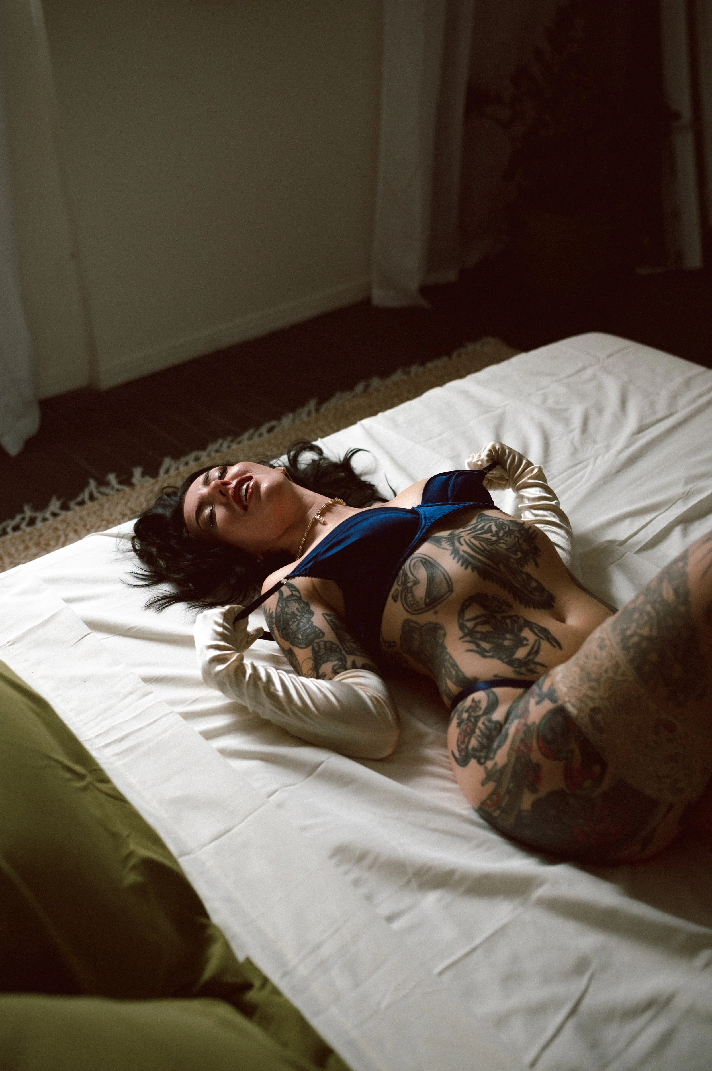 Las Vegas studio boudoir session with dramatic lighting and intimate indoor setting