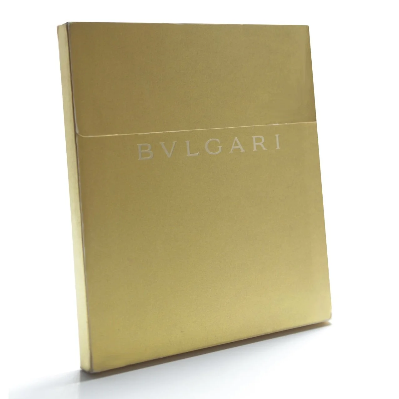 Gold metallic cover of Bulgari Holiday Catalog with interior fashion illustrations by don oehl