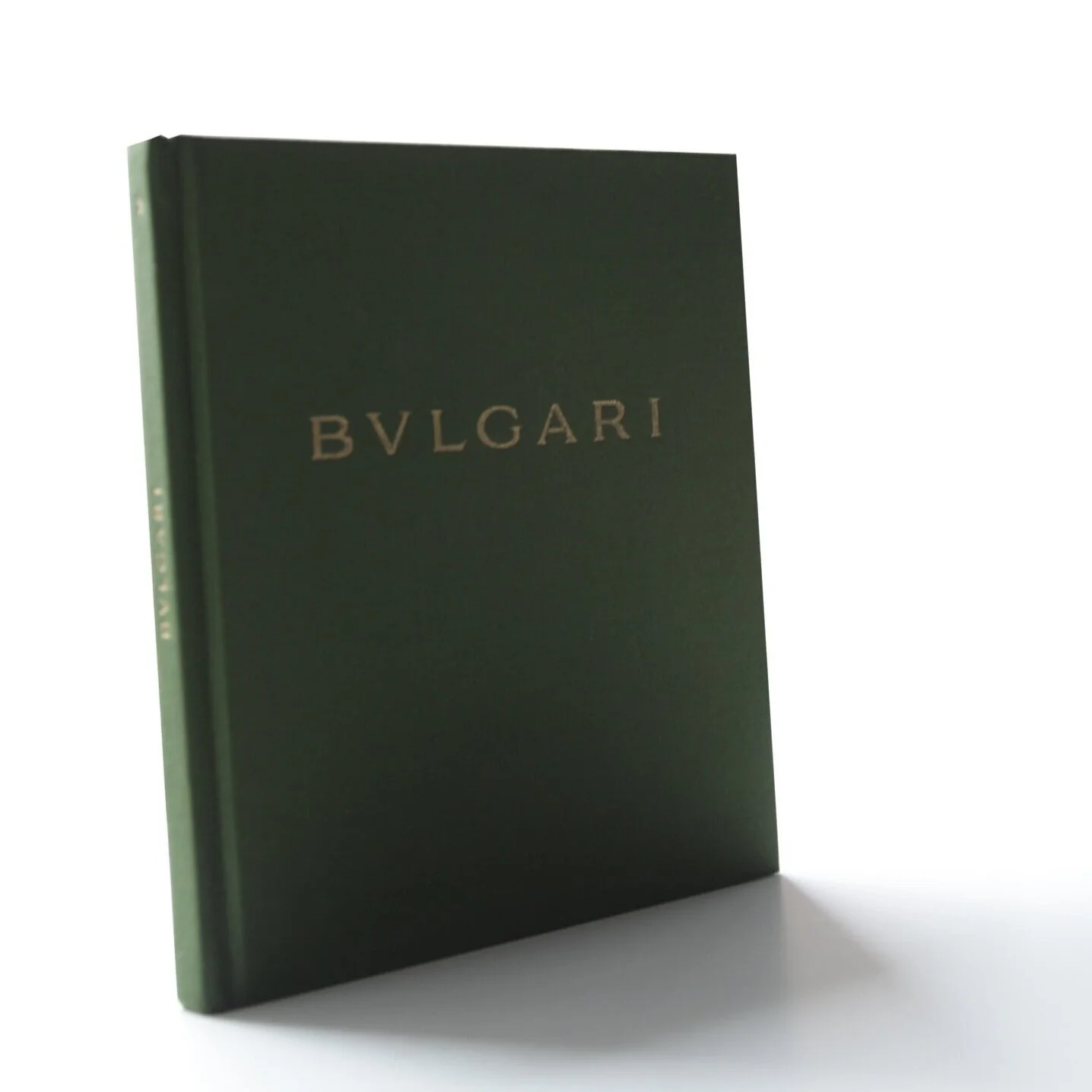 Green cover of Bulgari Holiday Catalog with interior fashion illustrations by don oehl