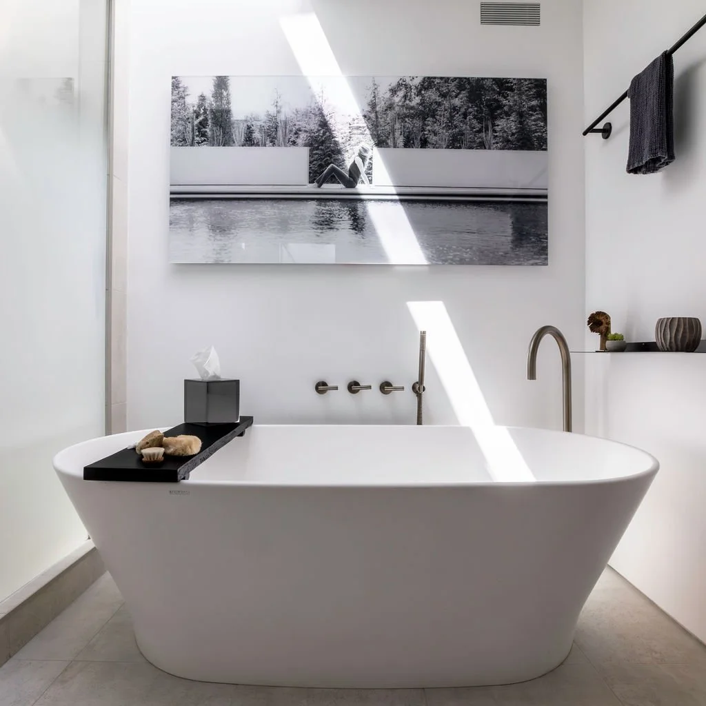 Primary bathroom photography balancing architecture, fixtures, artwork and natural light for a clean editorial presentation of the finished design.