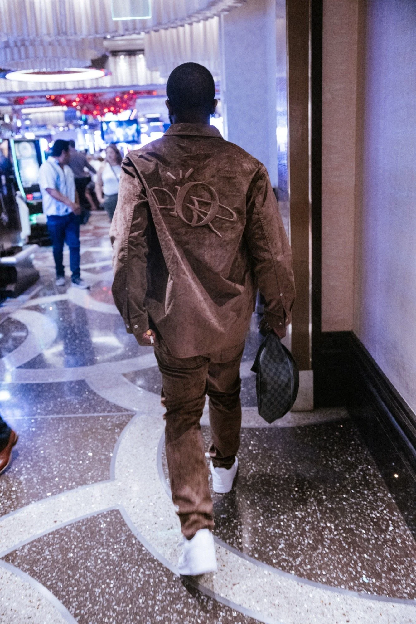 Lifestyle portrait walking away at casino — lifestyle photography — Universal Black Media Philadelphia