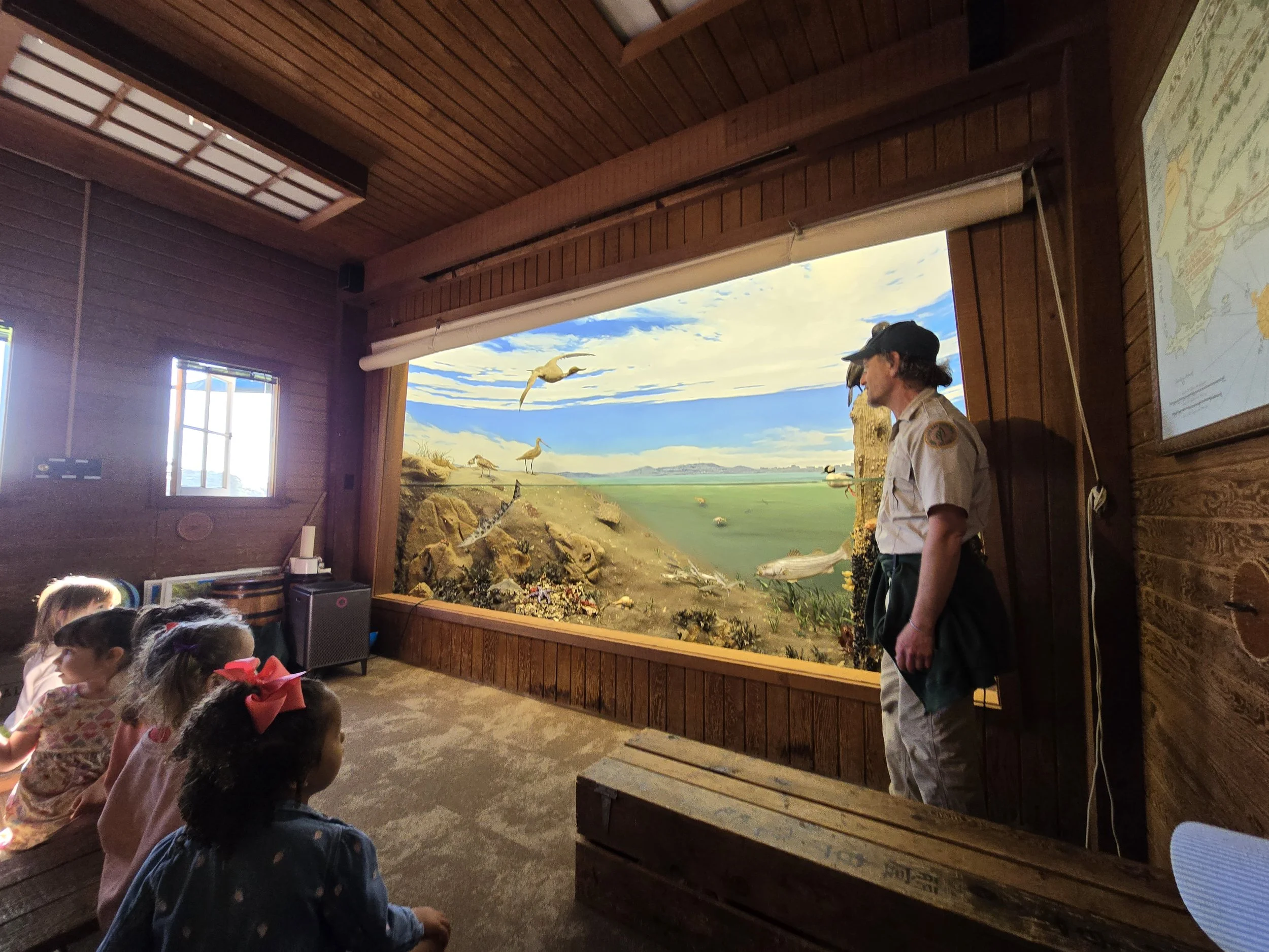 A naturalist teaches kids inside a classroom about the local habitat and creatures in the Bay Area near San Francisco.