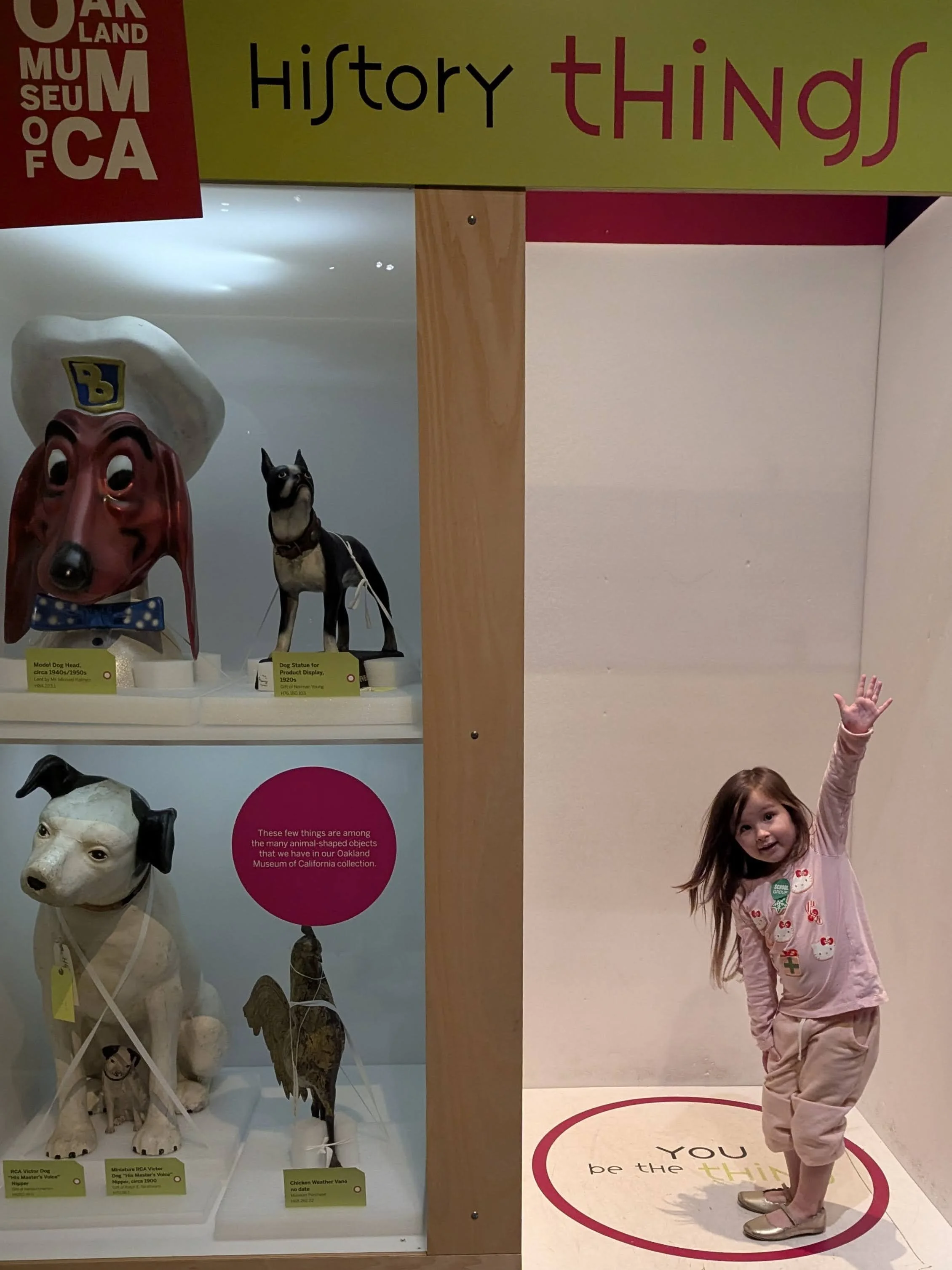 A little girl stands inside an interactive exhibit at the OCMA "The History of Things".