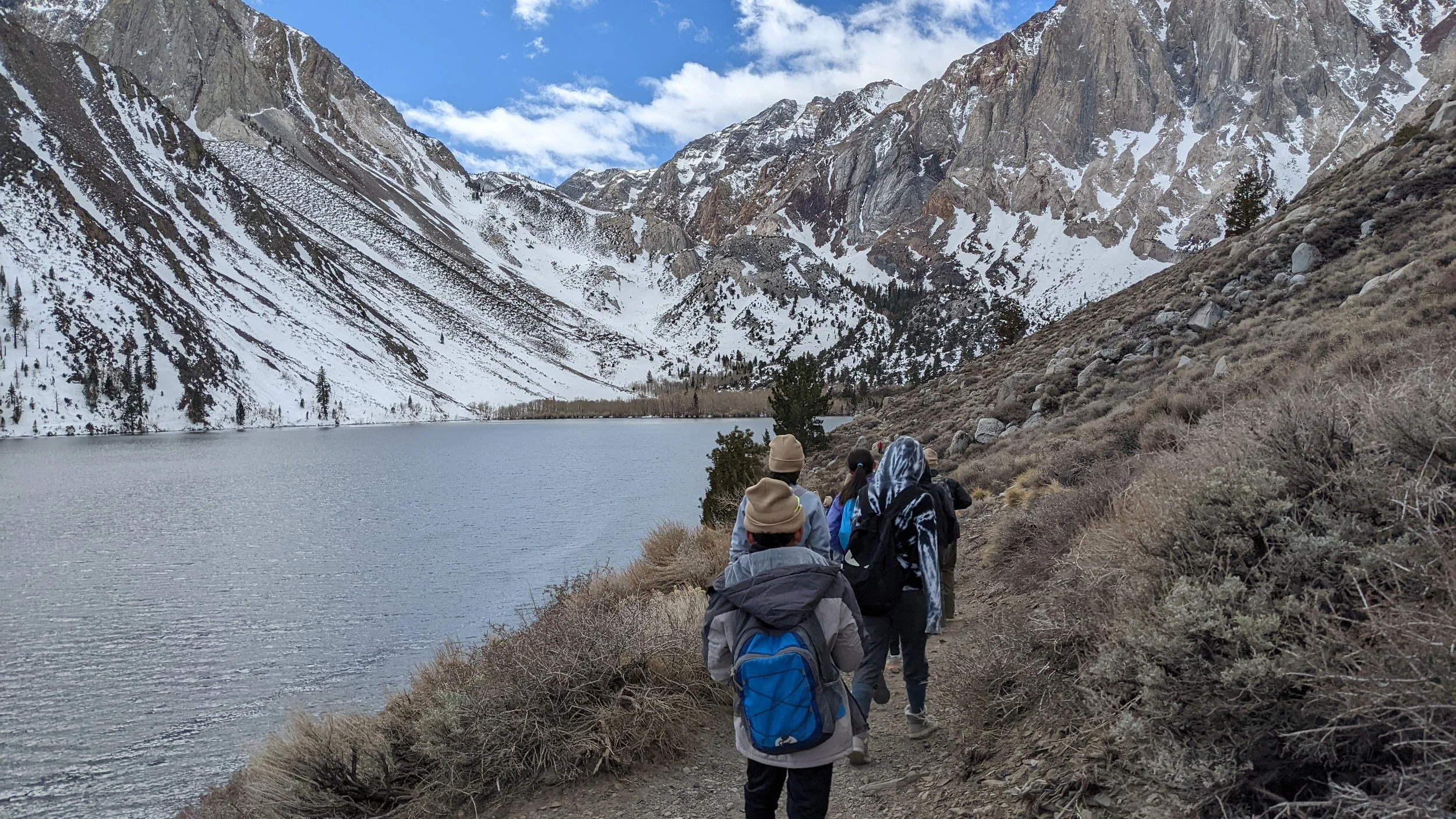 Students hike around an alpine lake in Mono County, CA.