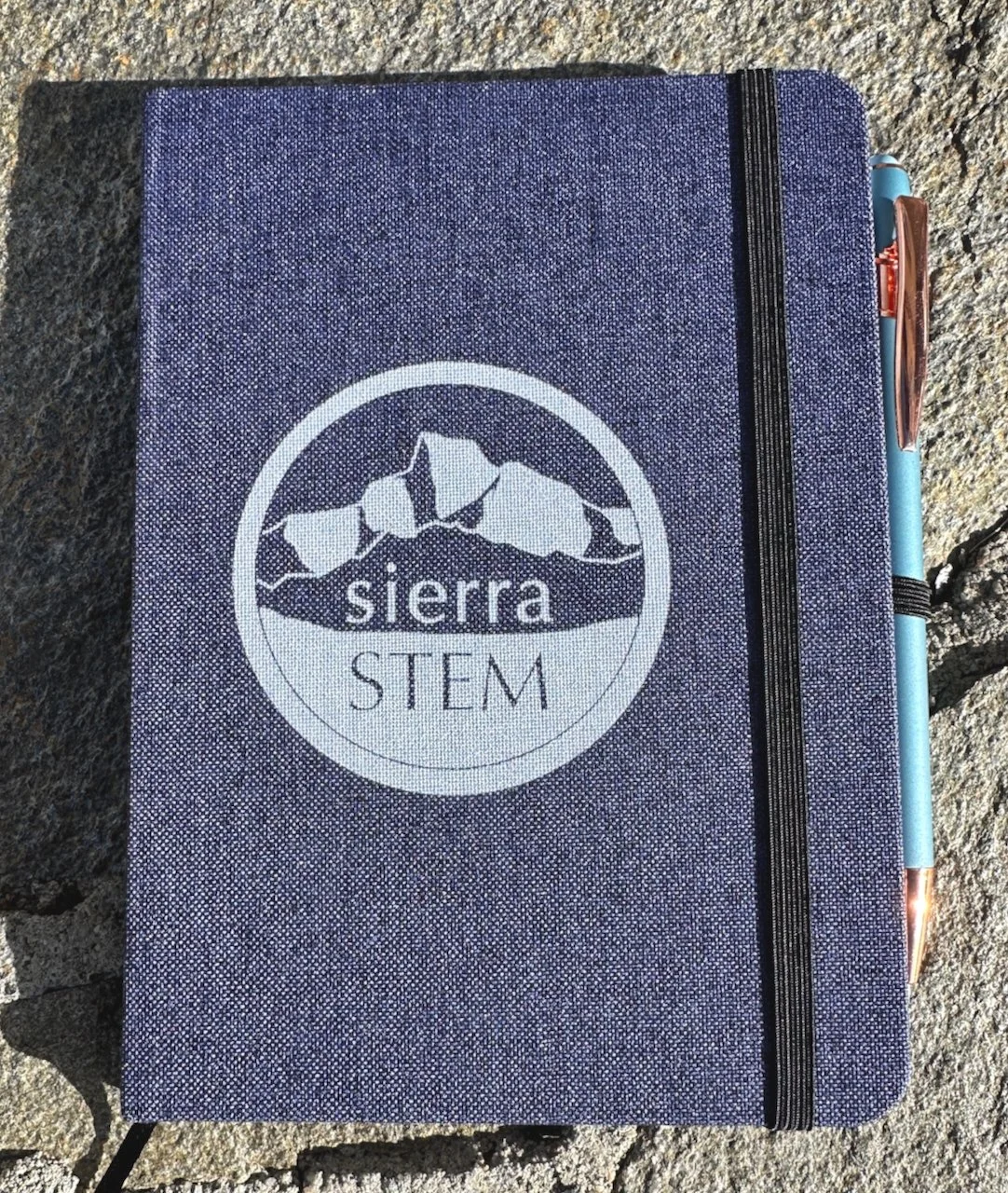 Blue notebook cover with pen.jpeg