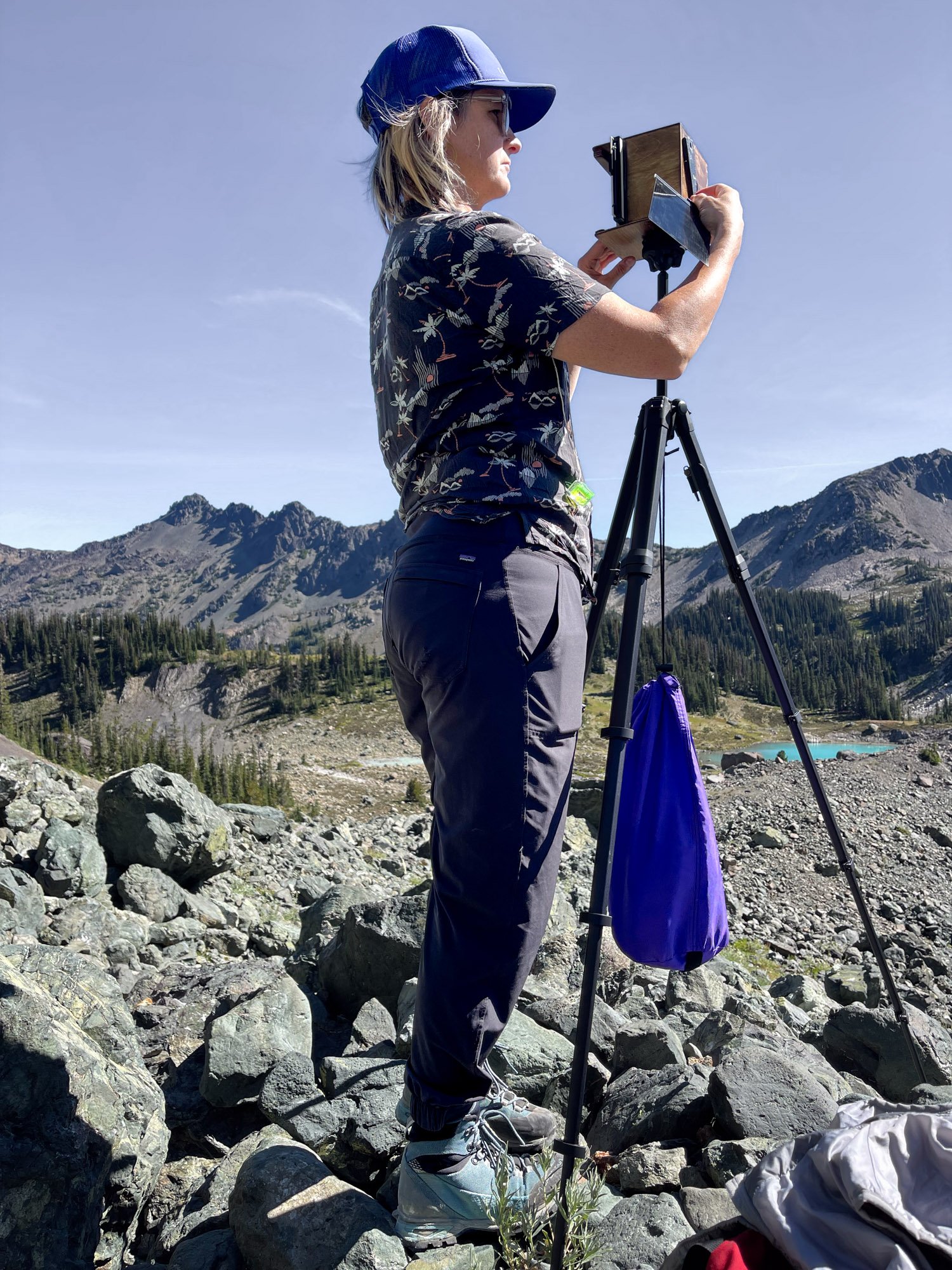 setting up the camera, framing the view, making the picture