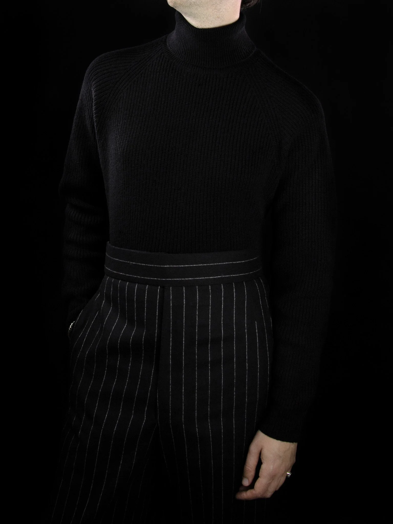 lawton-mens-english-rib-roll-neck-jumper-black-worn-front.jpg