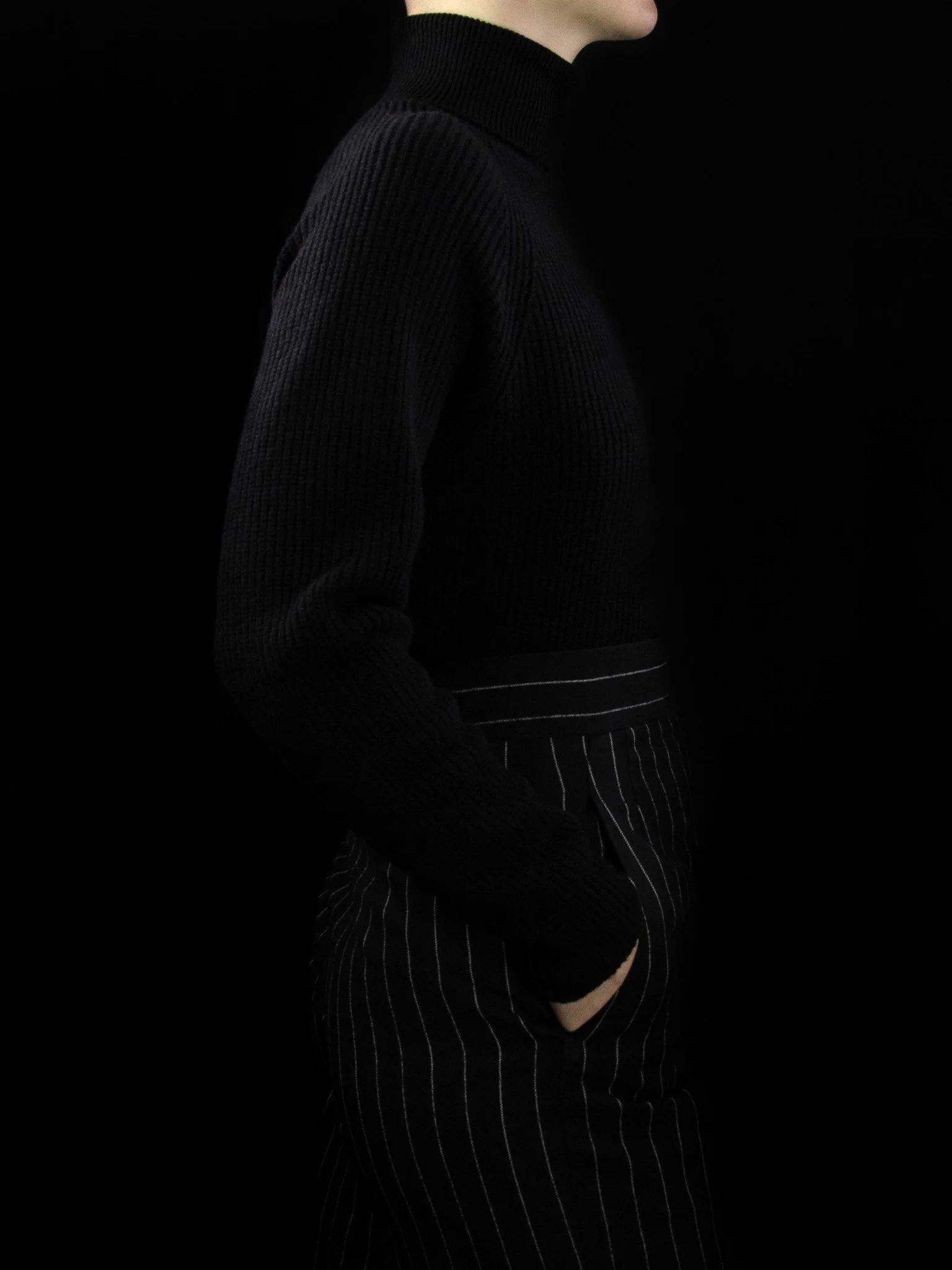 lawton-womens-english-rib-roll-neck-jumper-black-worn-side.jpg