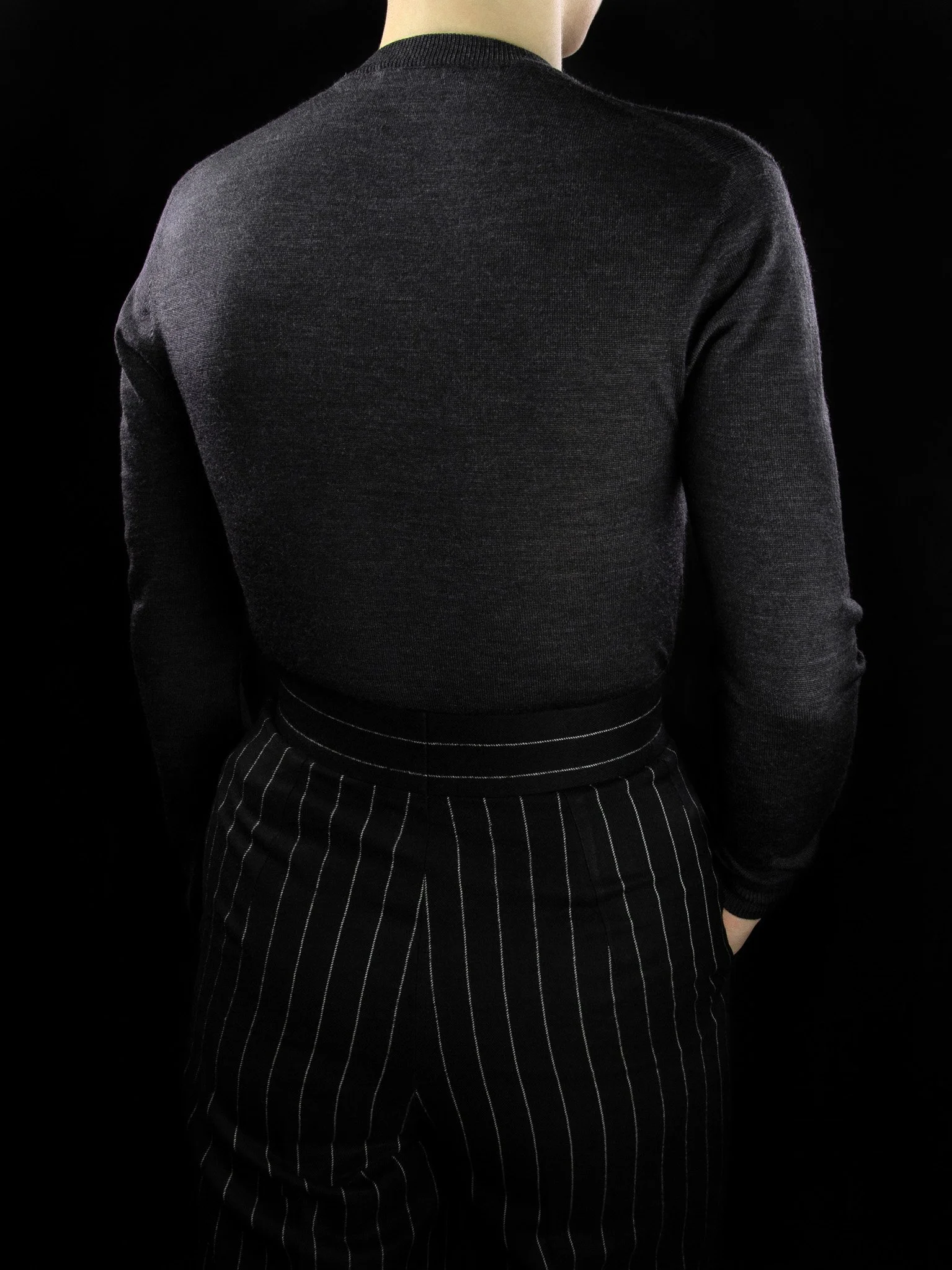 lawton-womens-V-neck-jumper-charcoal-worn-back.jpg