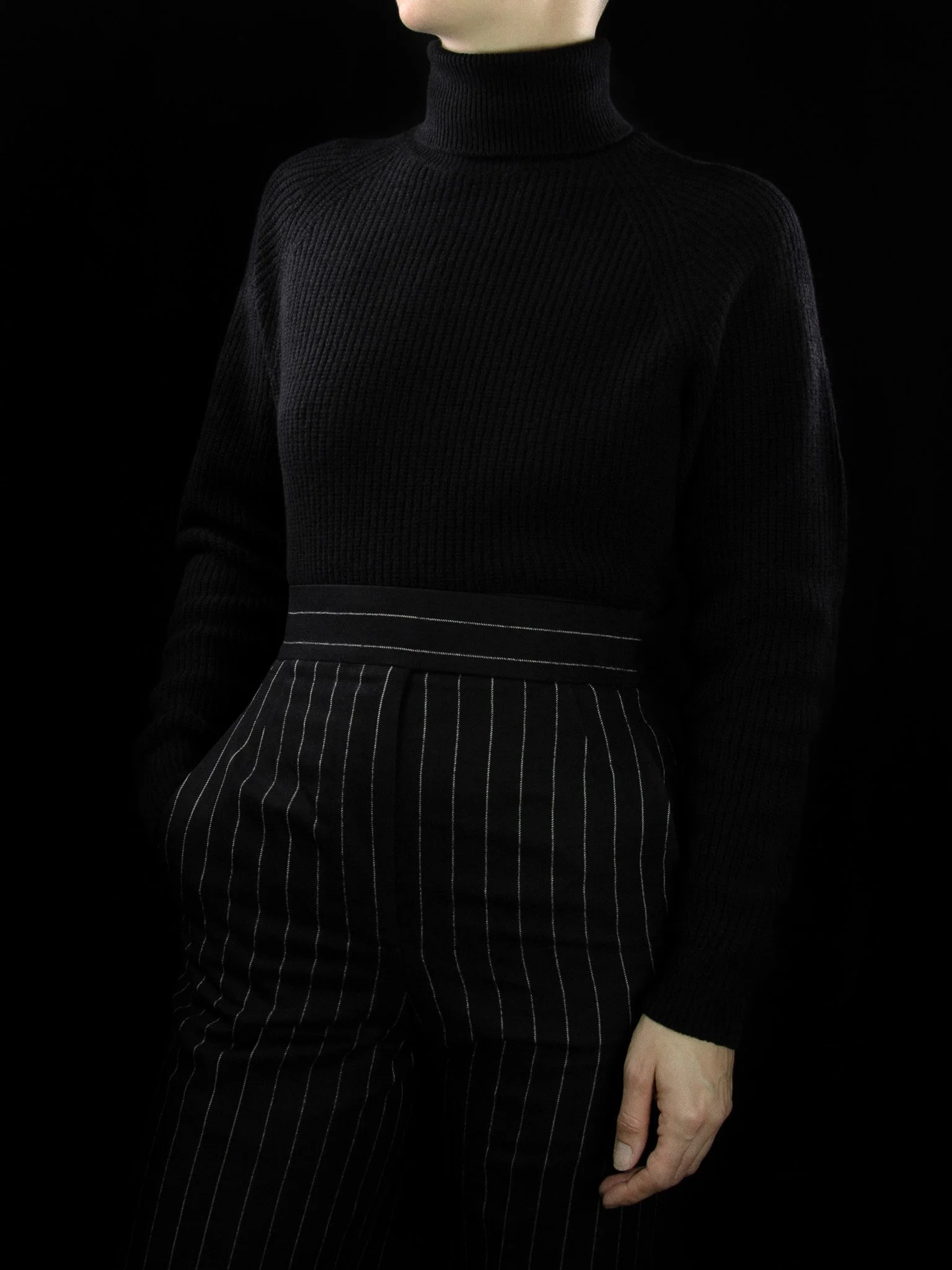 lawton-womens-english-rib-roll-neck-jumper-black-worn-front.jpg