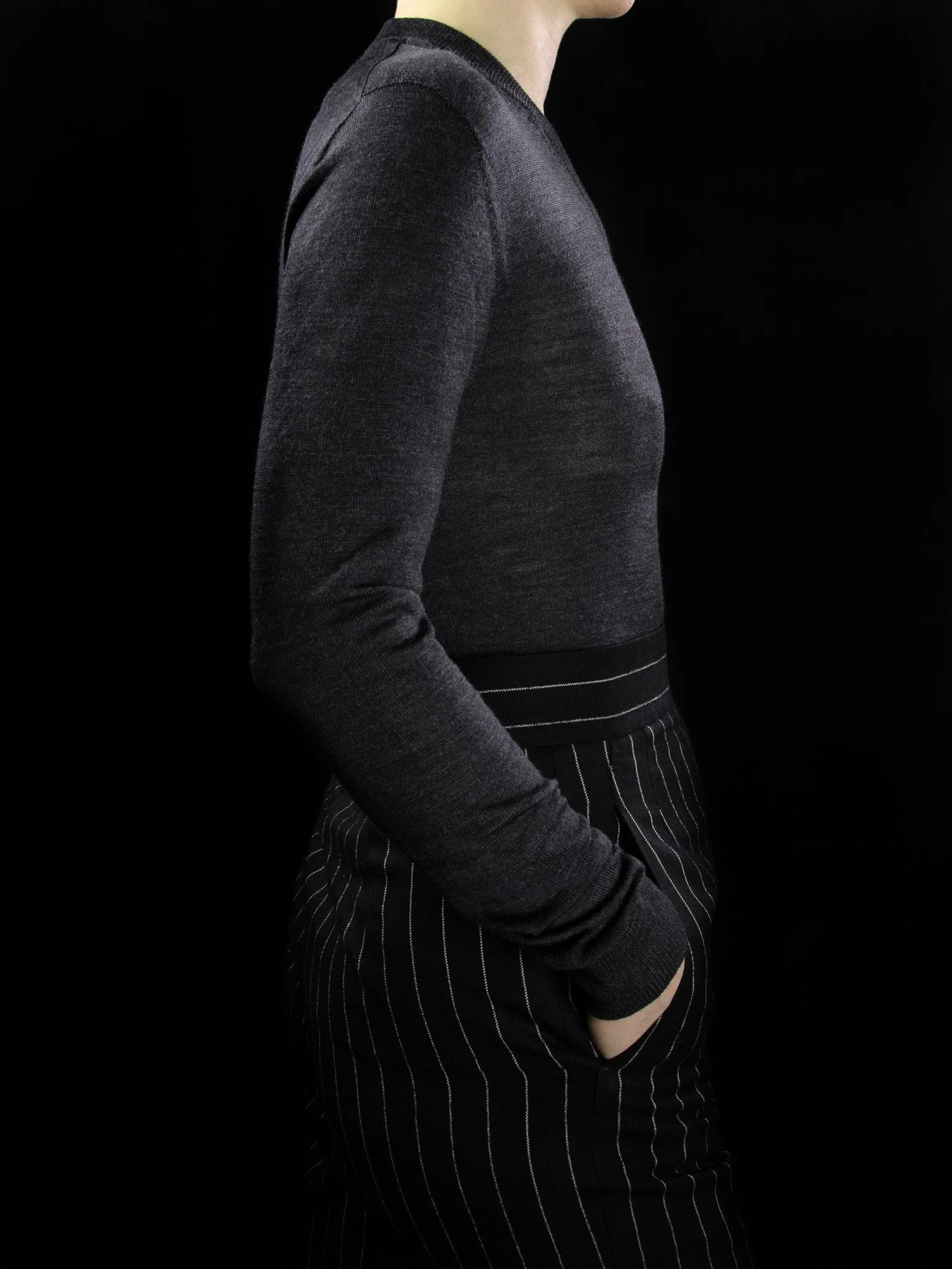 lawton-womens-V-neck-jumper-charcoal-worn-side.jpg