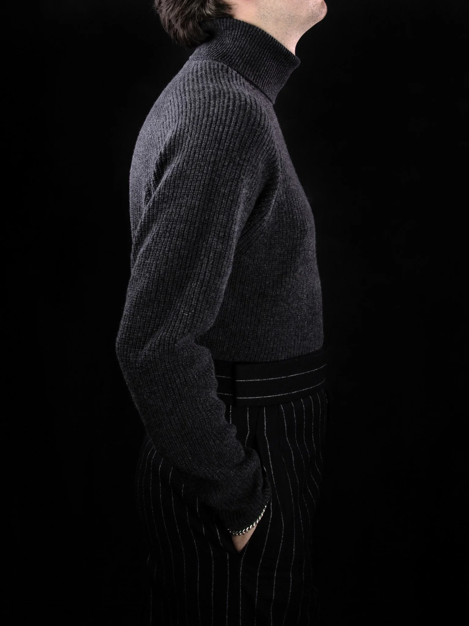 lawton-mens-english-rib-roll-neck-jumper-charcoal-worn-side.jpg