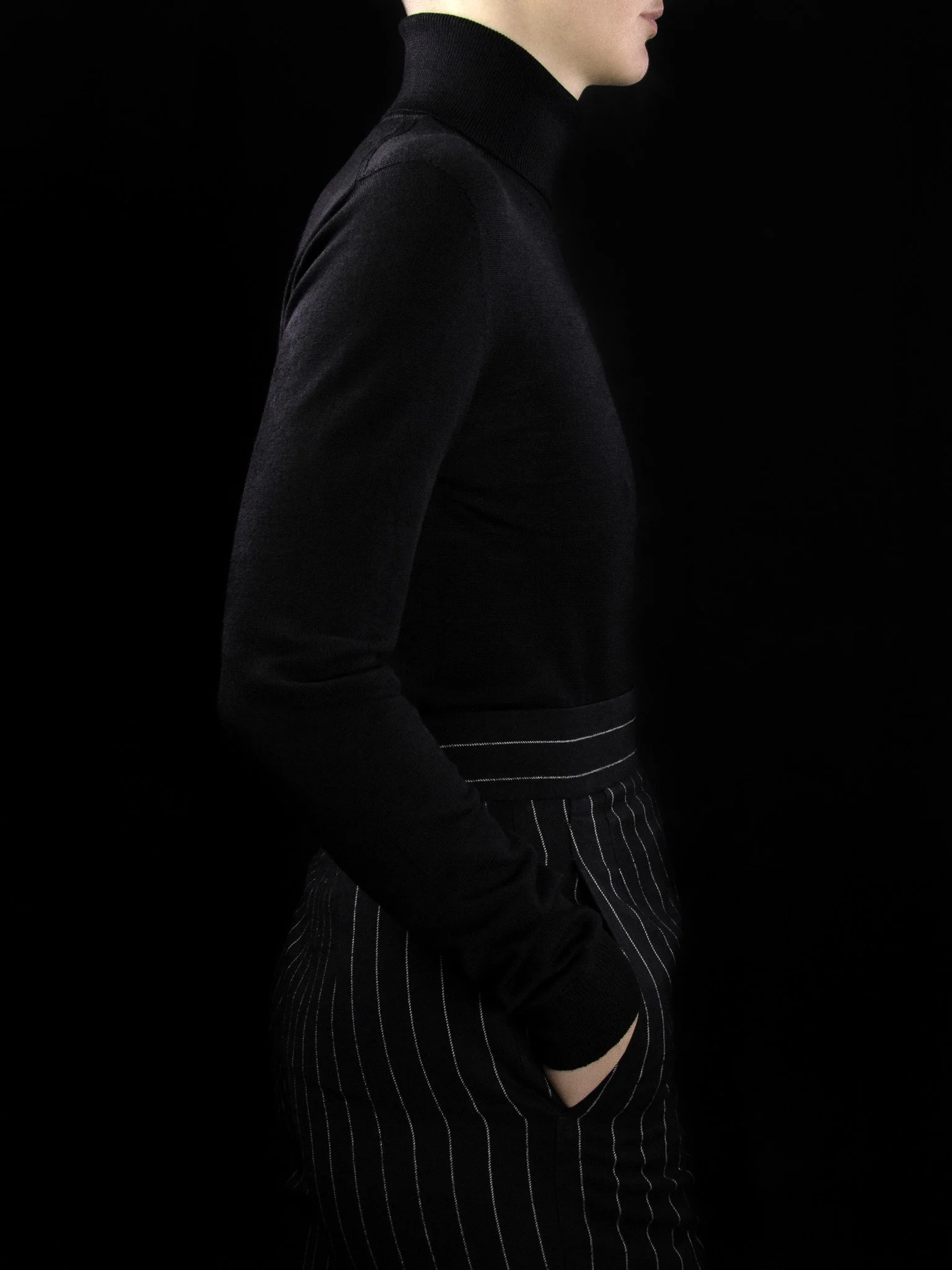 lawton-womens-roll-neck-jumper-black-worn-side.jpg
