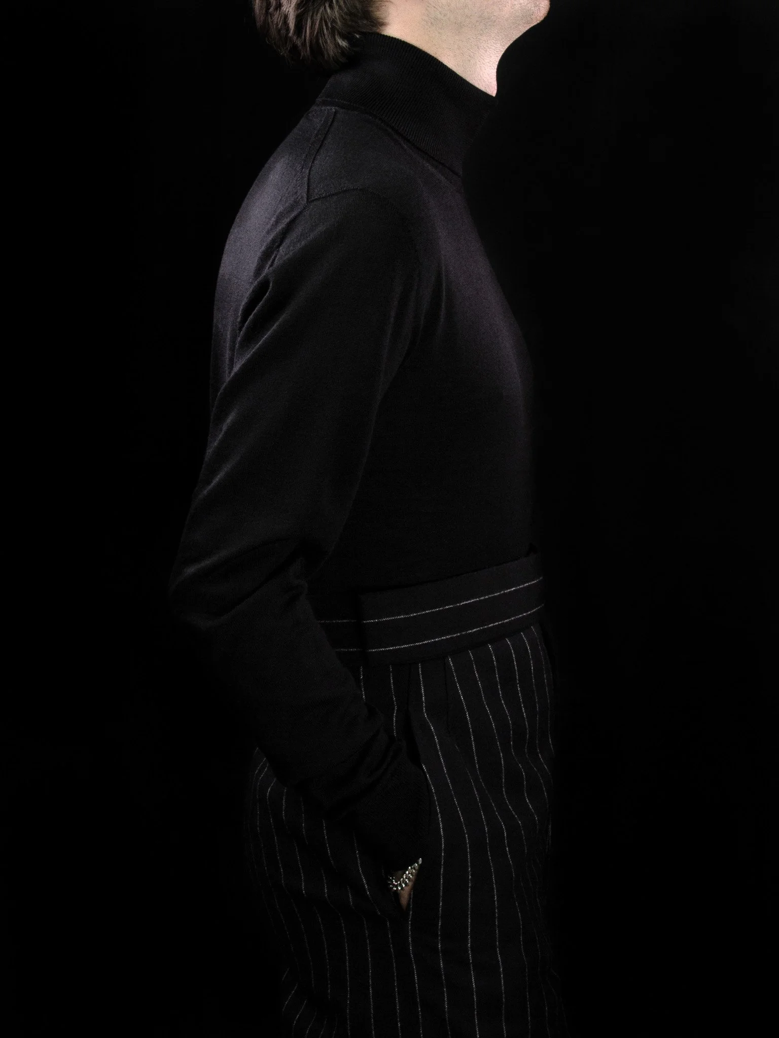 lawton-mens-roll-neck-jumper-black-worn-side.jpg
