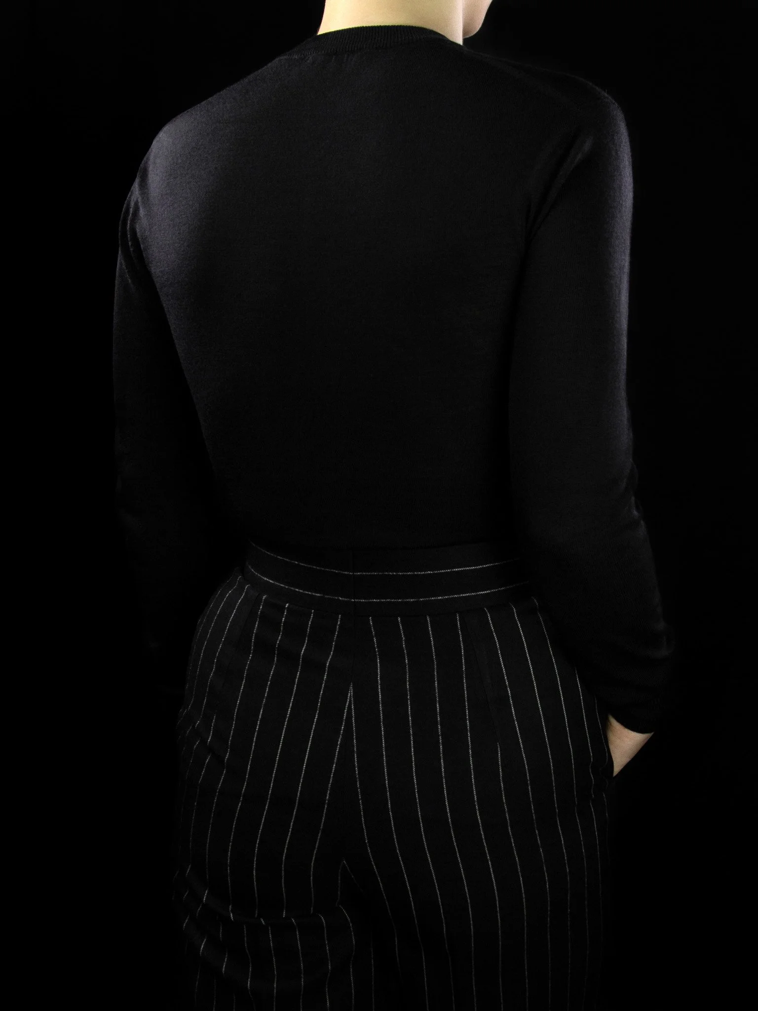 lawton-womens-V-neck-jumper-black-worn-back.jpg