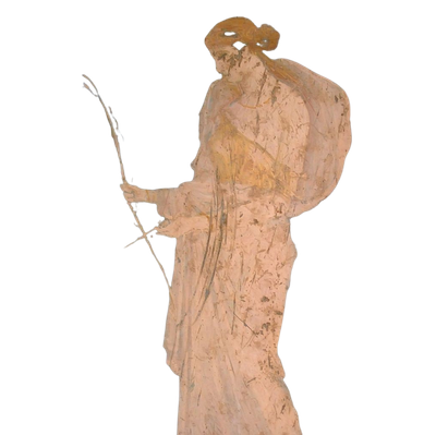 A wooden carved figure of an old man wearing a hat and holding a walking stick.