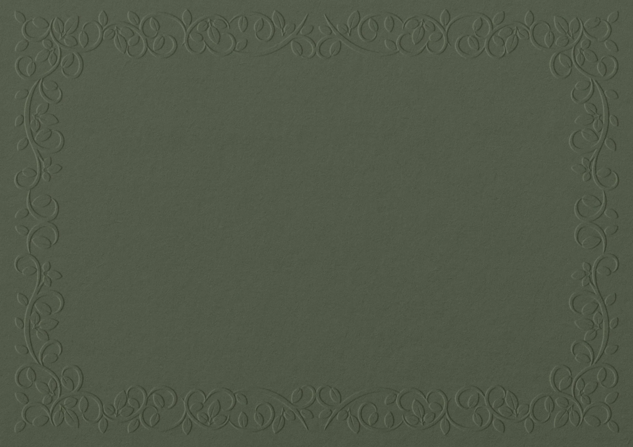 A green textured surface with an embossed decorative floral border along the edges.