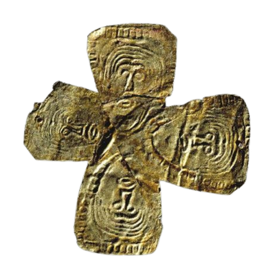 Ancient carved symbol resembling a cross with circular and spiral patterns