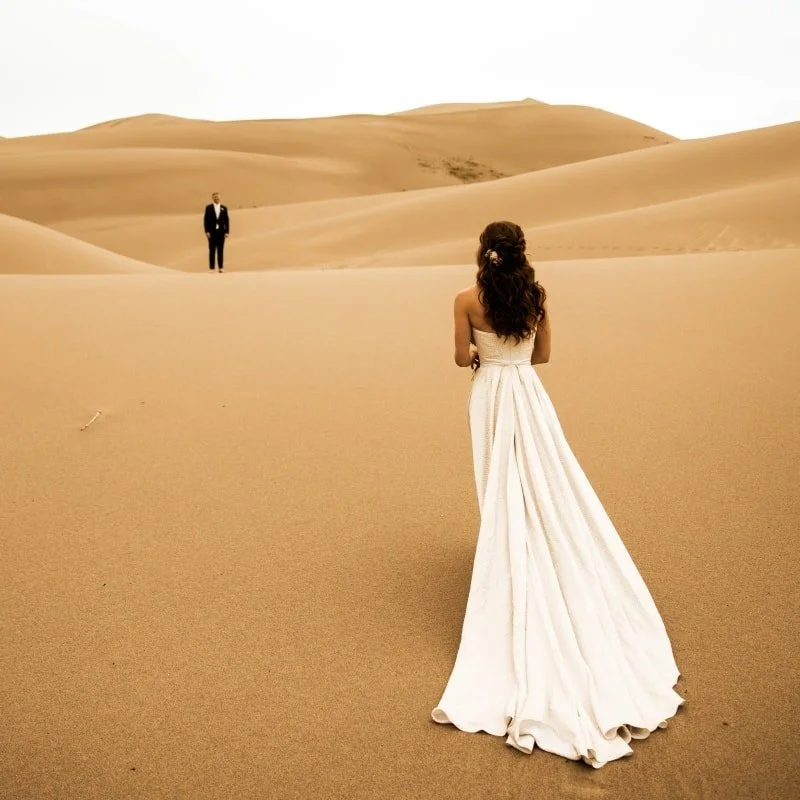 One of my absolute favorite brides of 2025  sent me photos from her Sand Dunes National Park wedding. Phoebe's dress had this beautiful texture and underlying gold shimmer thread. I knew it was going to be perfect on the warm sand, but these photos s
