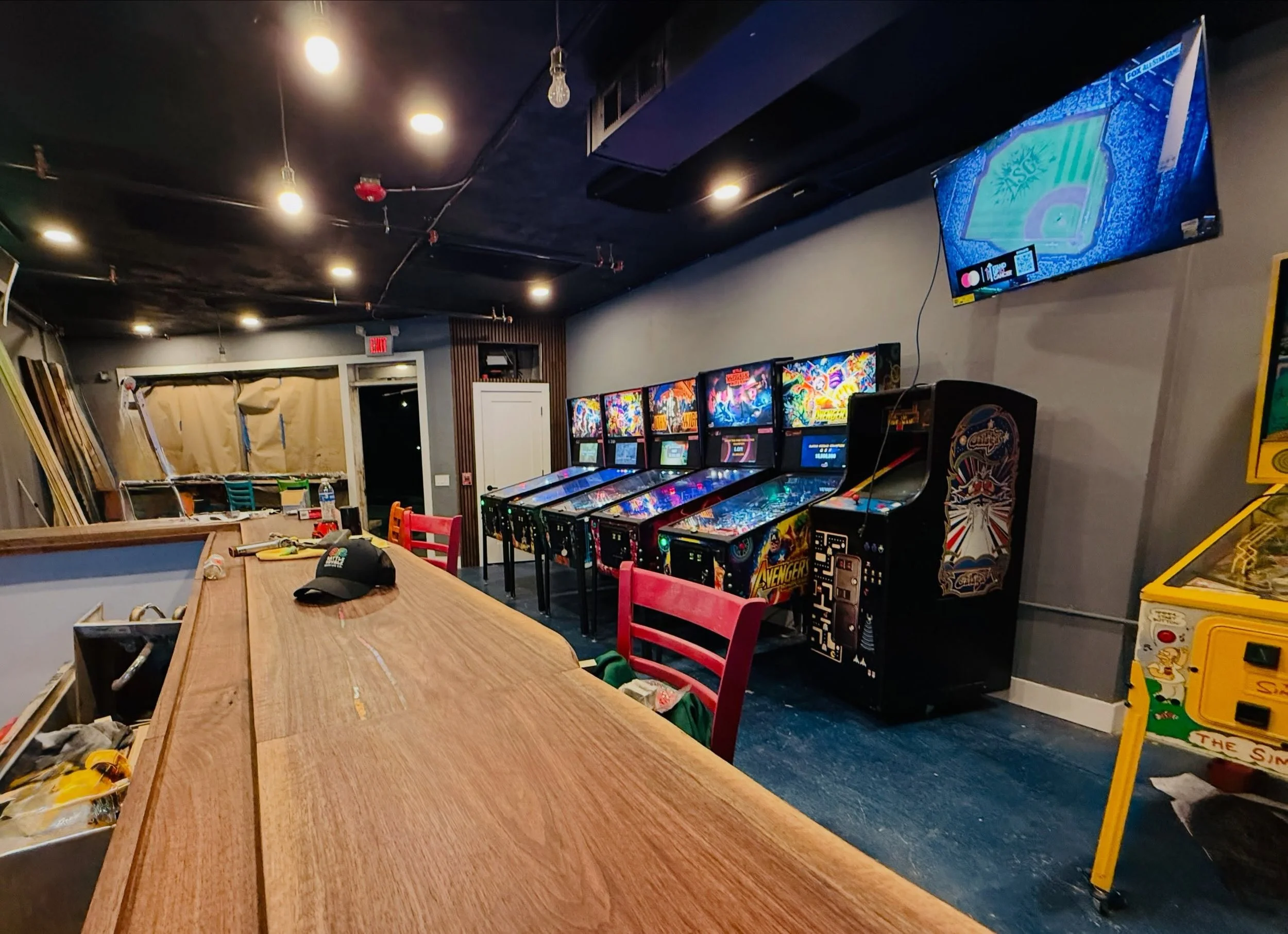 More progress, it&rsquo;s getting close! Some of the games have finally arrived at their new home, and Matt built this amazing live edge black walnut bar last week. Finishing up our final paperwork and adding all the finishing touches with the brewer