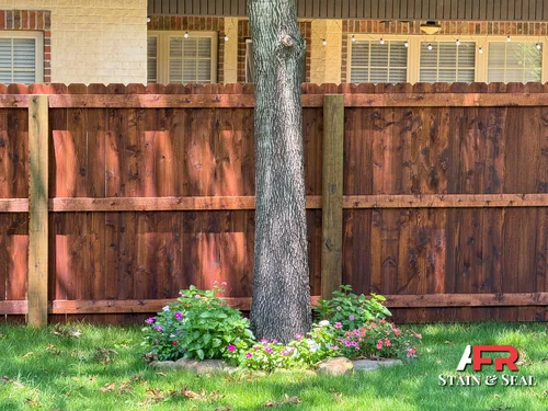 Privacy fence with semi-transparent chestnut stain