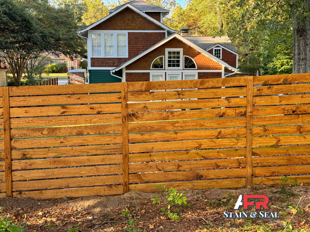 Horizontal privacy fence with semi-transparent pecan stain