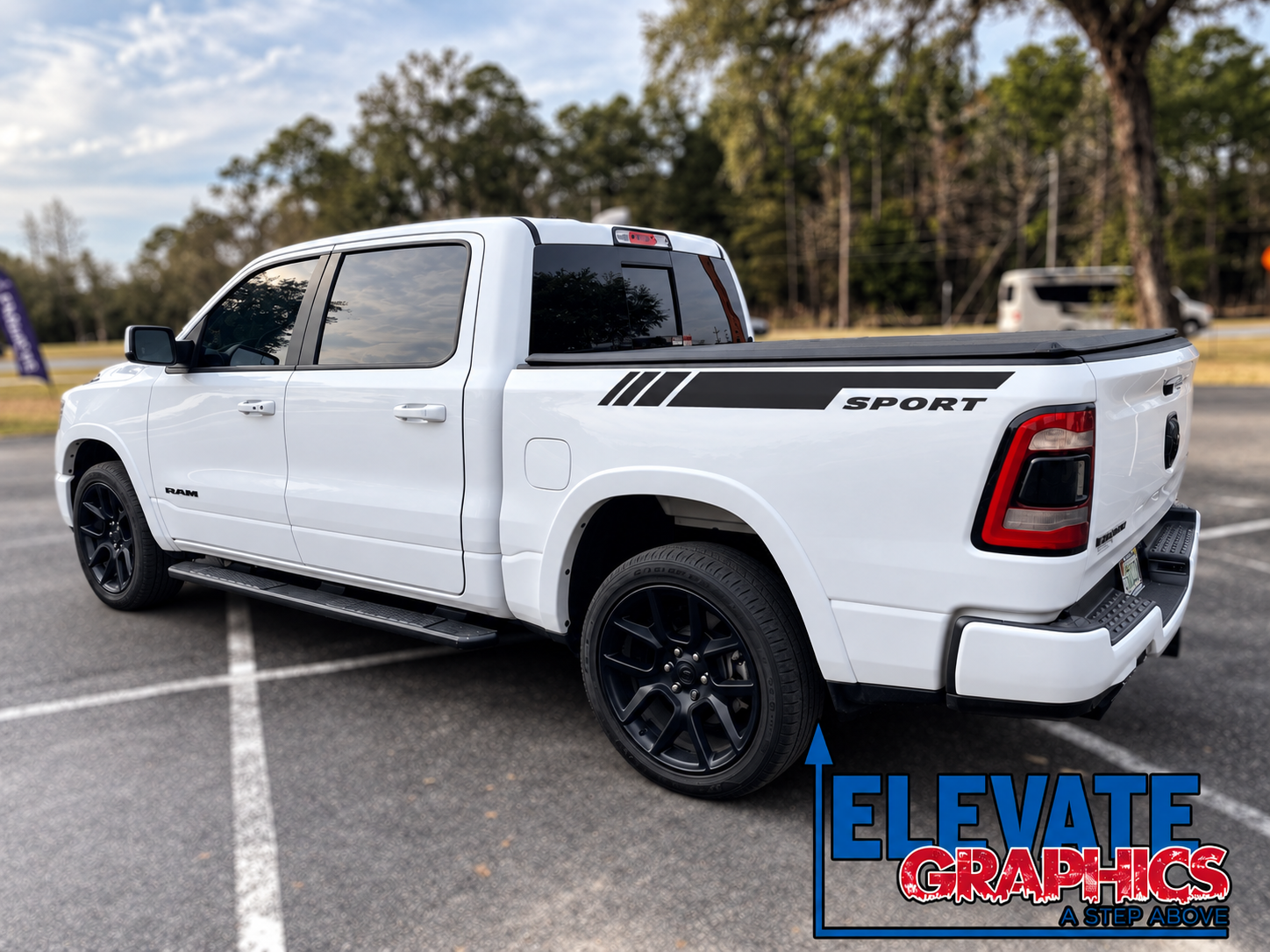 White Sport Pickup in a Landscaped Parking Lot.png (Copy)