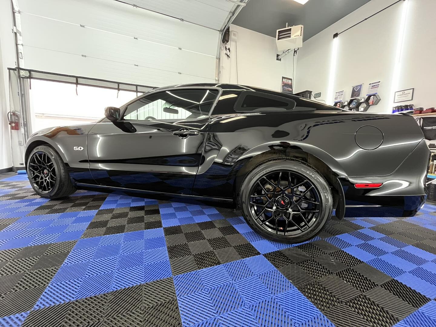 The 2014 Ford Mustang GT is a classic American muscle car that boasts a powerful V8 engine with 420 horsepower and 390 lb-ft of torque. It has a sleek and aggressive exterior design that pays homage to its iconic predecessors, while also incorporatin