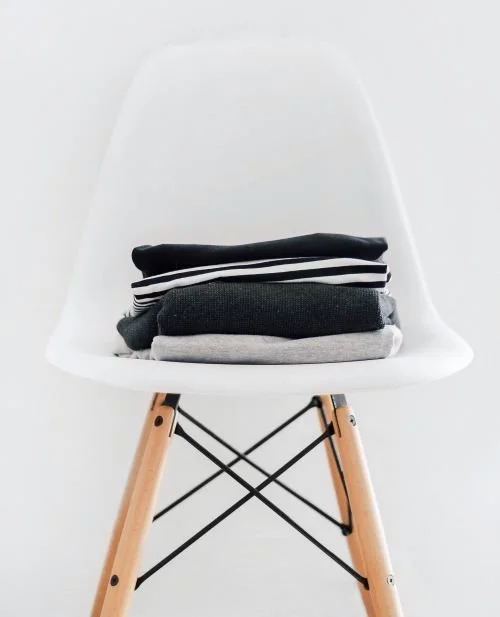 clothes folded on chair