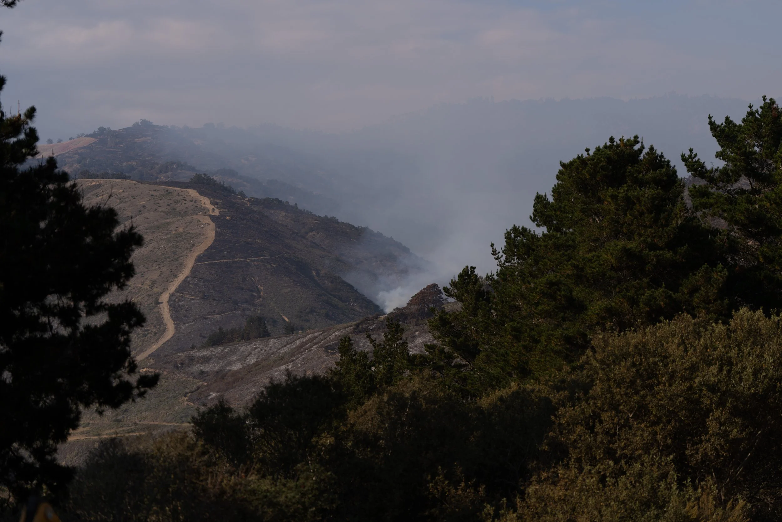 Smoke rises from the Plaskett Fire in the hills east of Highway 1 near Plaskett in Big Sur, Calif., Friday, Sept. 4, 2026.
