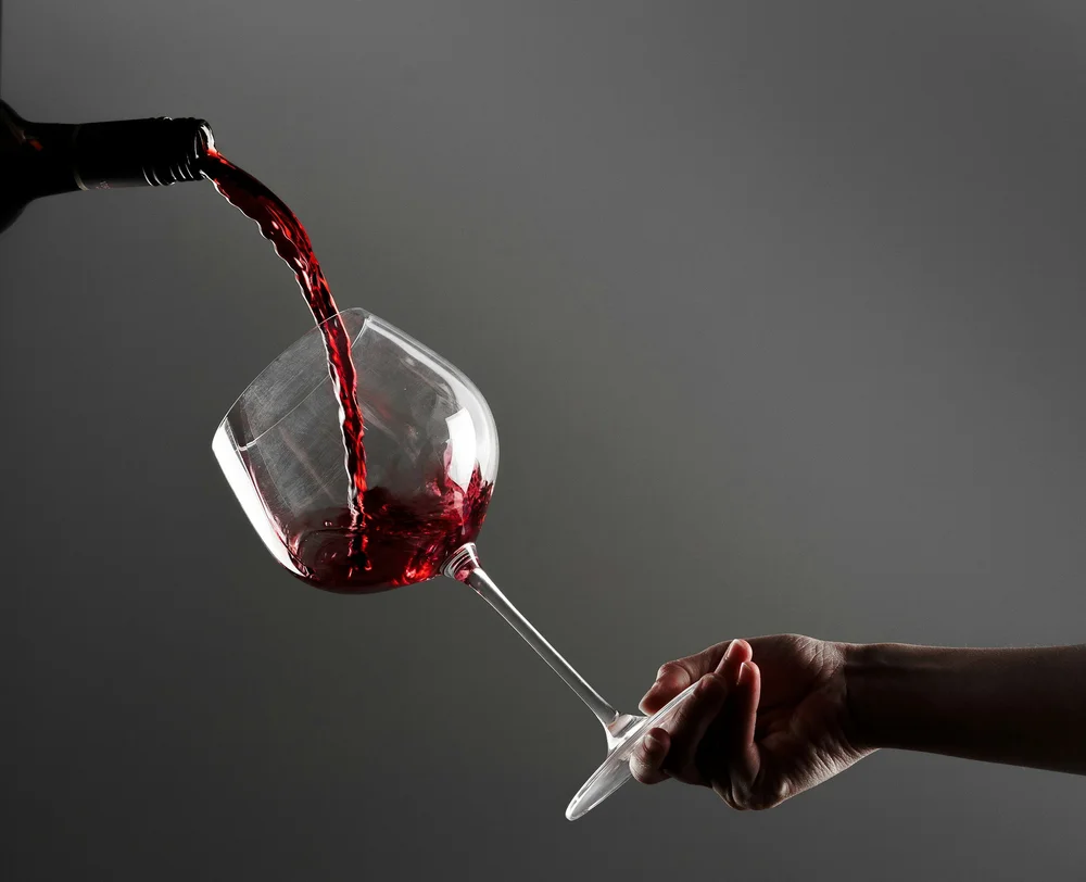 Red wine being poured into a glass