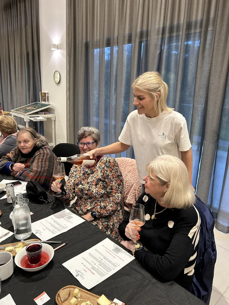 Guests gathered around tables for a wine tasting in Port Stephens