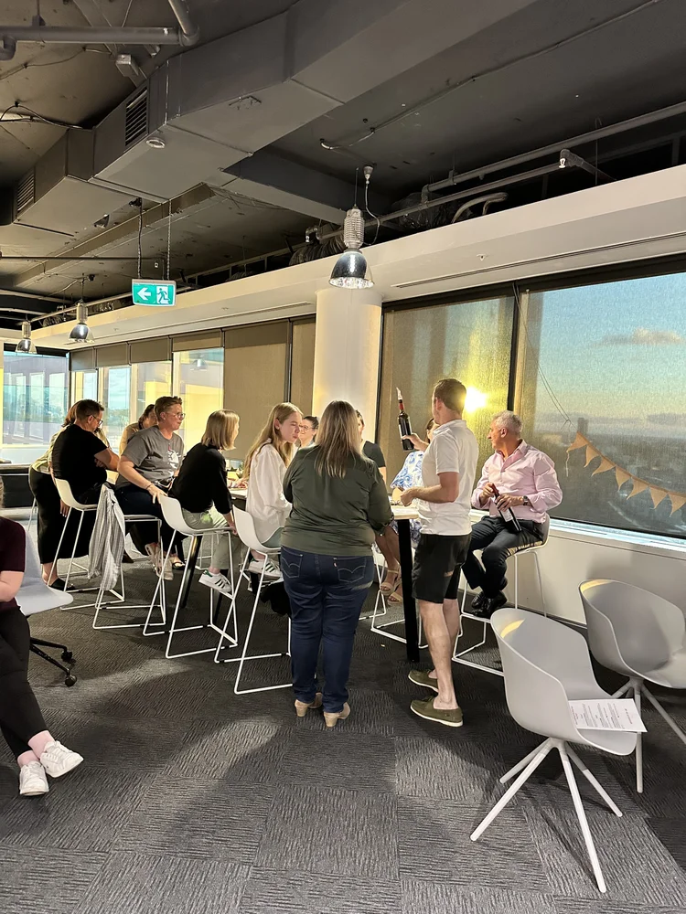 Guests enjoying a corporate wine tasting at a Sydney workplace