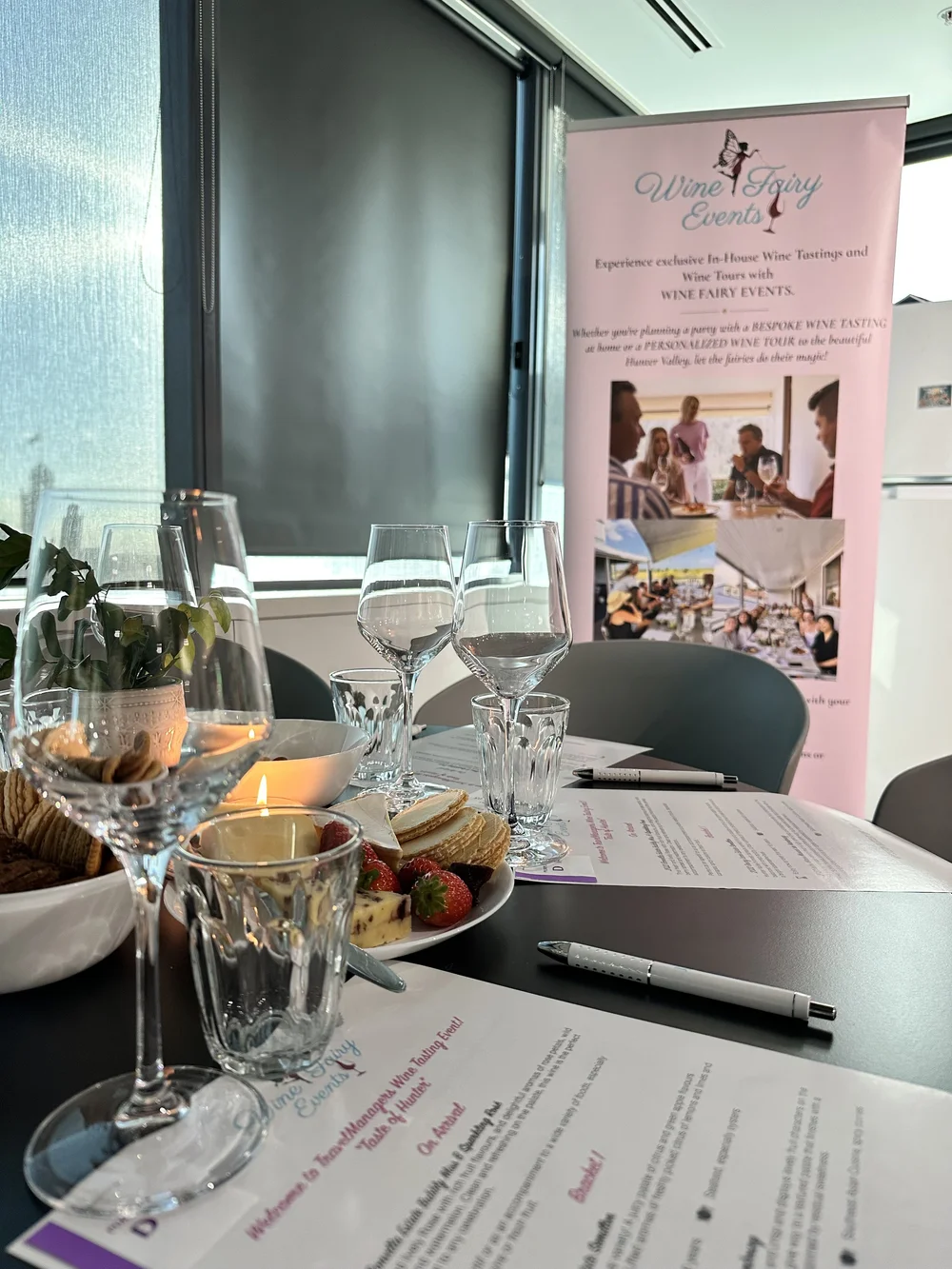 Wine glasses and tasting notes set up for a corporate wine tasting in Sydney