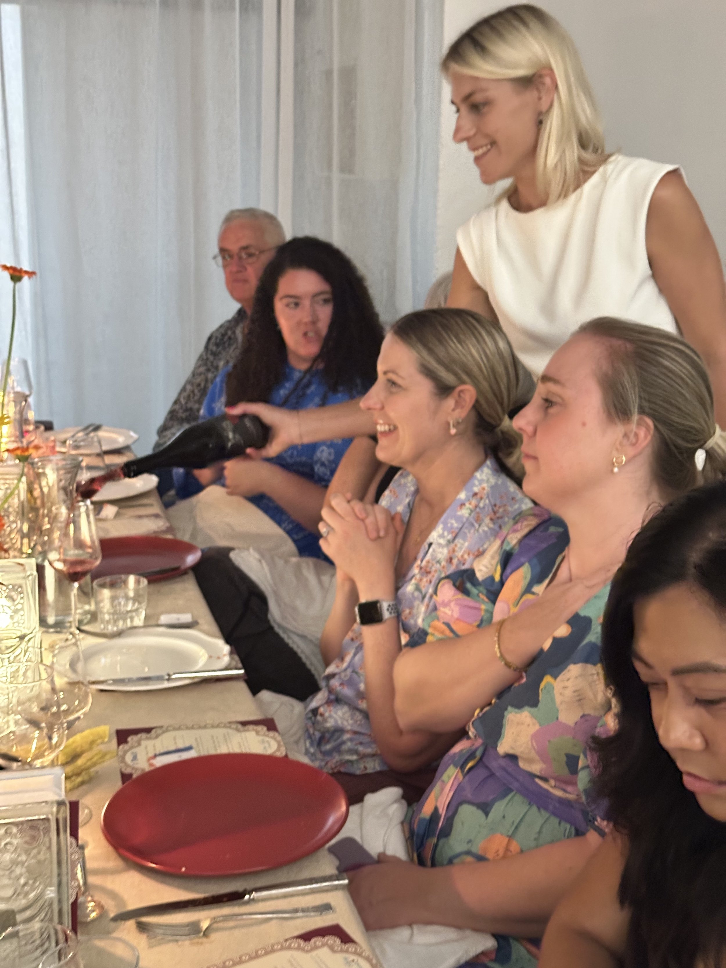 Kat pouring wine at the Wine and Food match Event with A Tavola in Newcastle