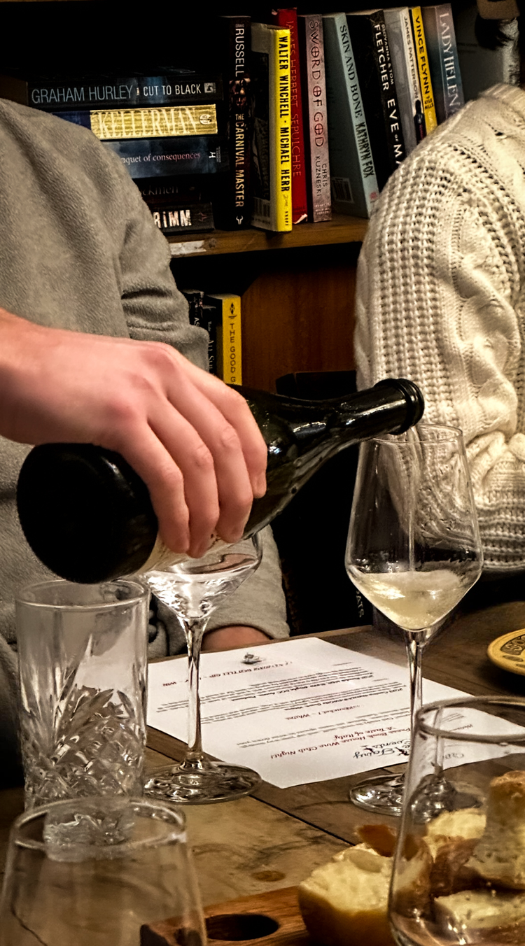 Wine being poured during a tasting at the Press Bookhouse Café in Newcastle