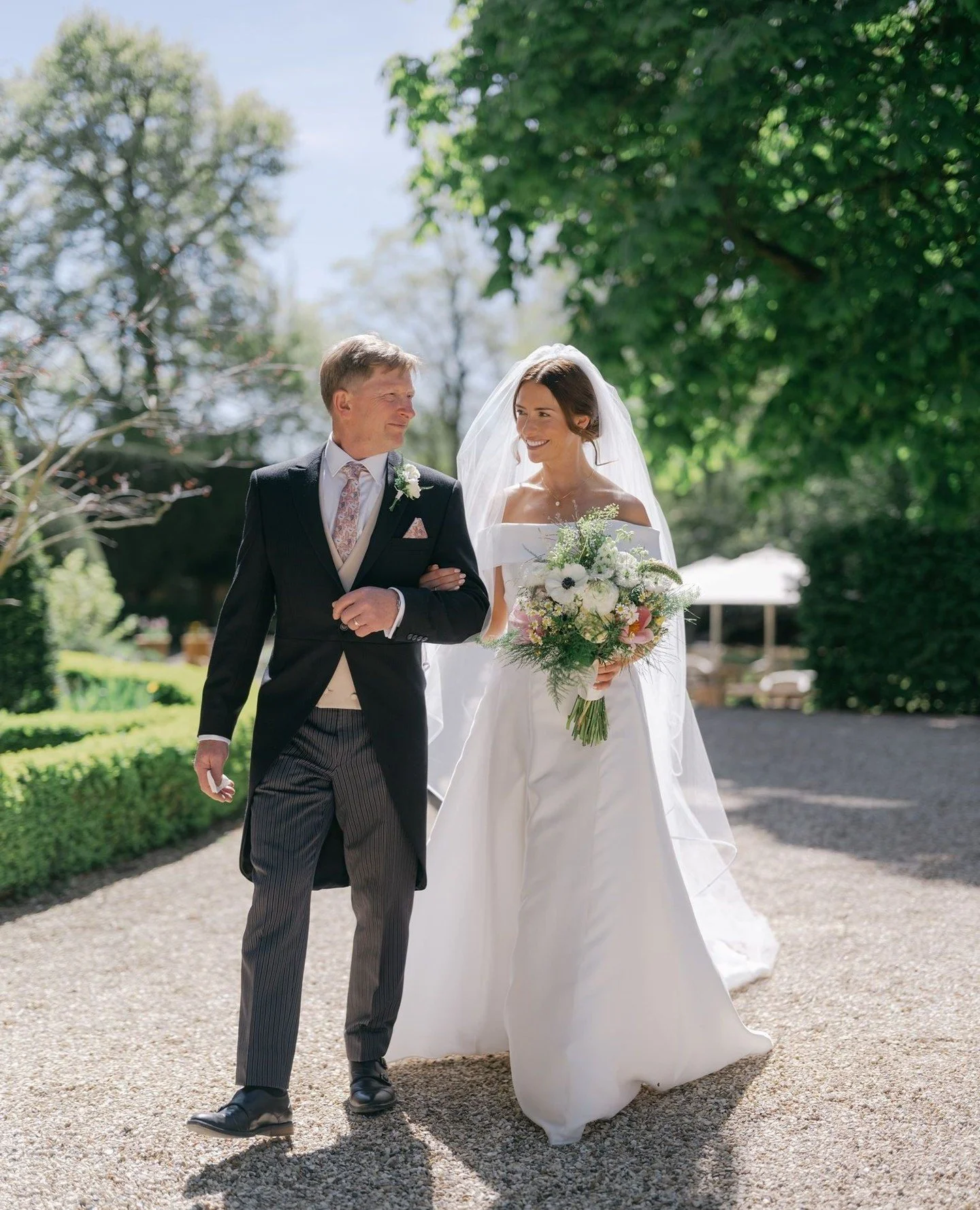 Alisha's quiet walk to the church with her father. ⁠
In April Alisha &amp; David were married in the picturesque village of Lower Slaughter in the Cotswolds. Can't wait to share more!⁠
⁠
⁠
⁠
@slaughtersmanor⁠
⁠
@mach_management⁠
@lynnejessettfloristr