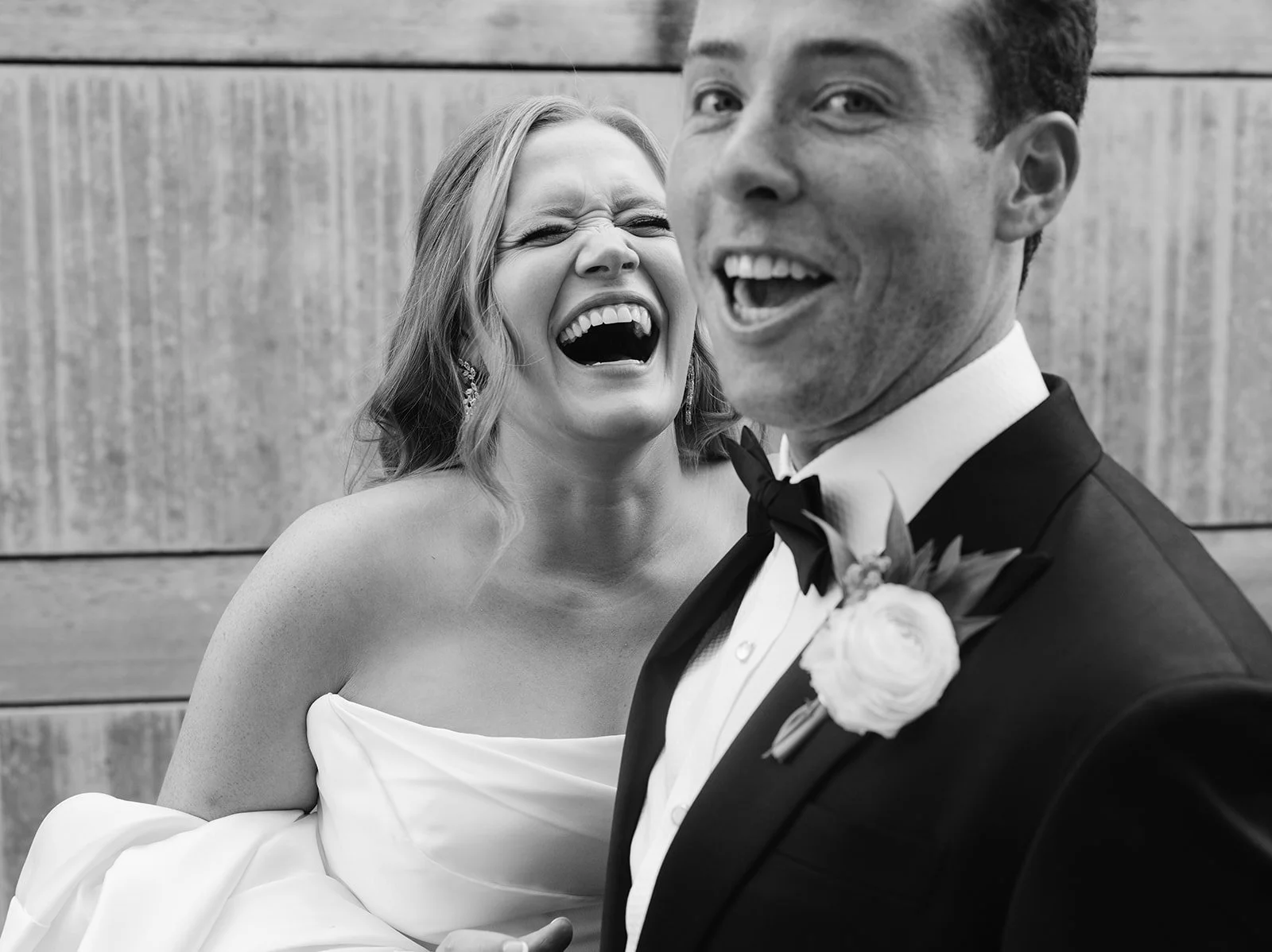 bride and groom laughing at a wedding in arkansas taken by miles witt boyer