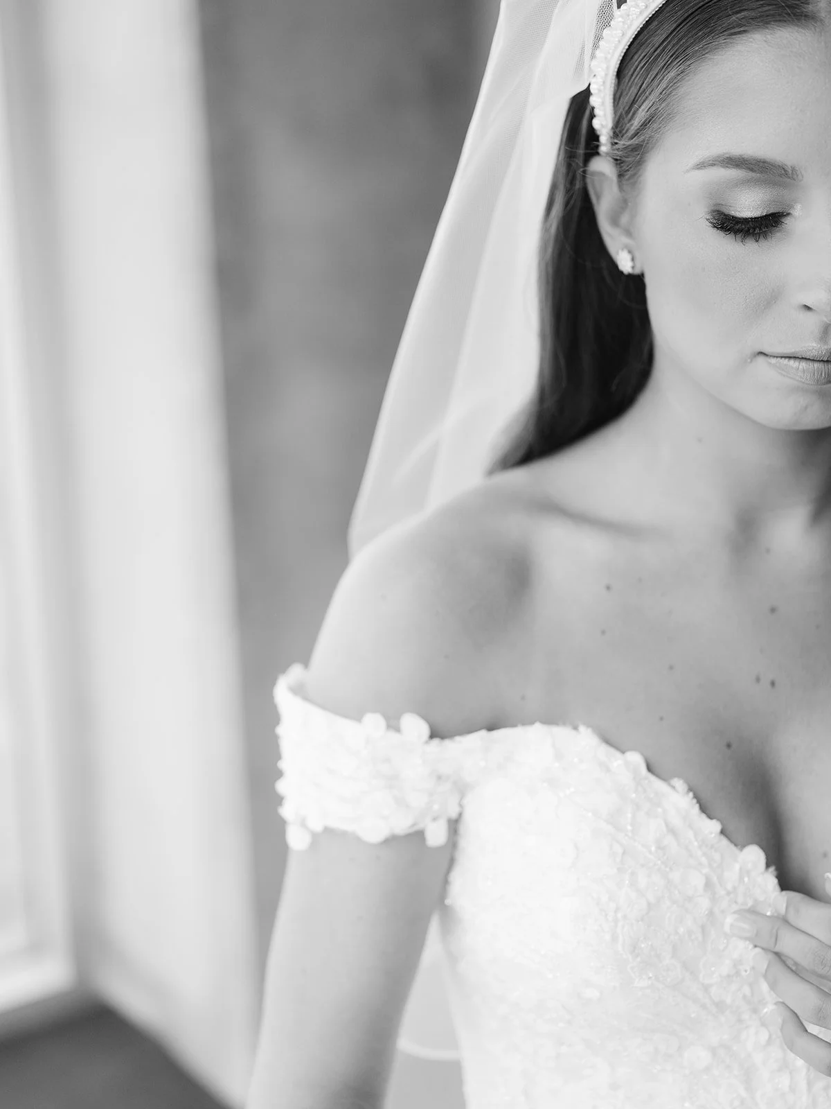 Elegant black and white bridal portrait with natural light and off the shoulder lace wedding dress by Arkansas wedding photographer Miles Witt Boyer.