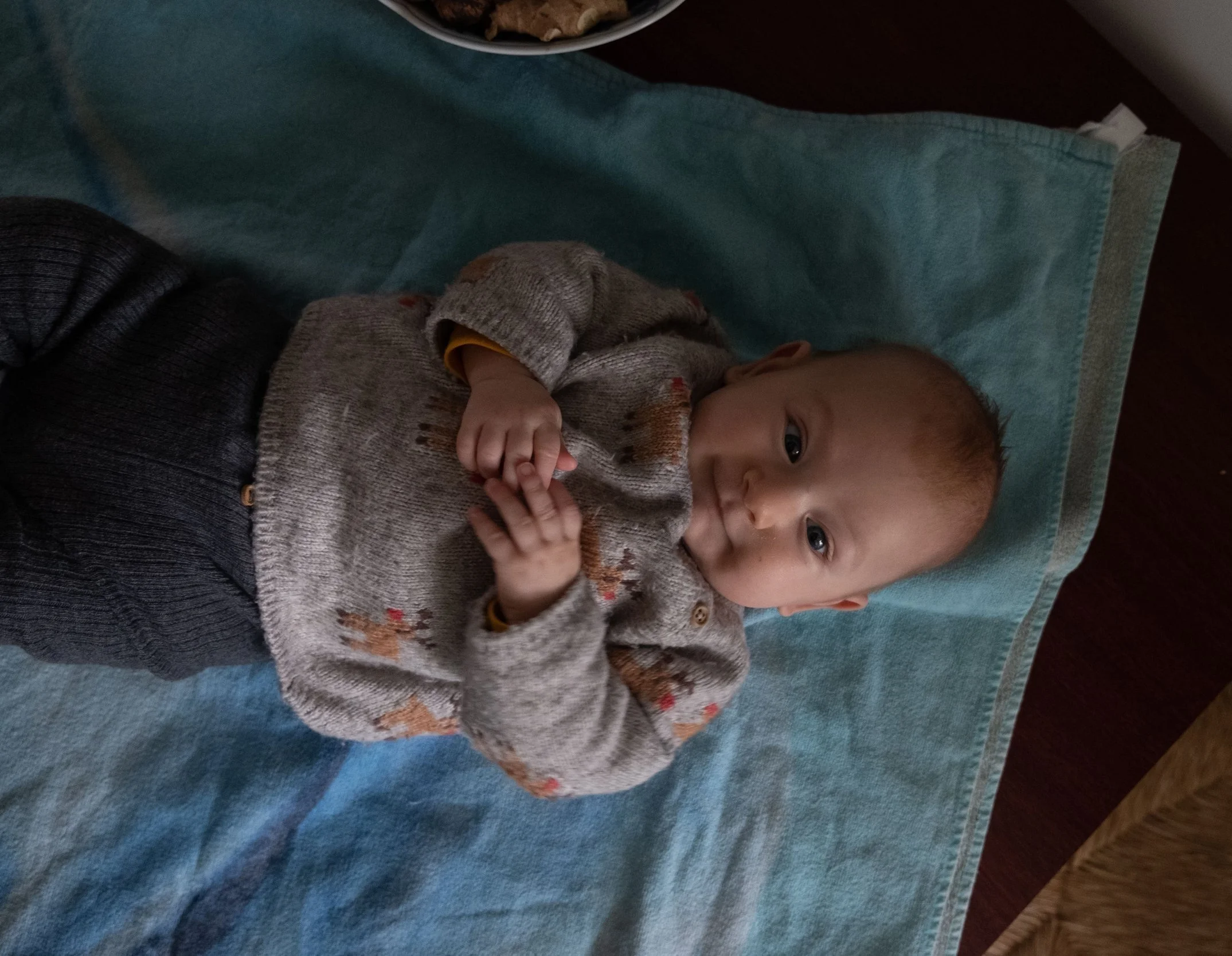 A baby on the kitchen table