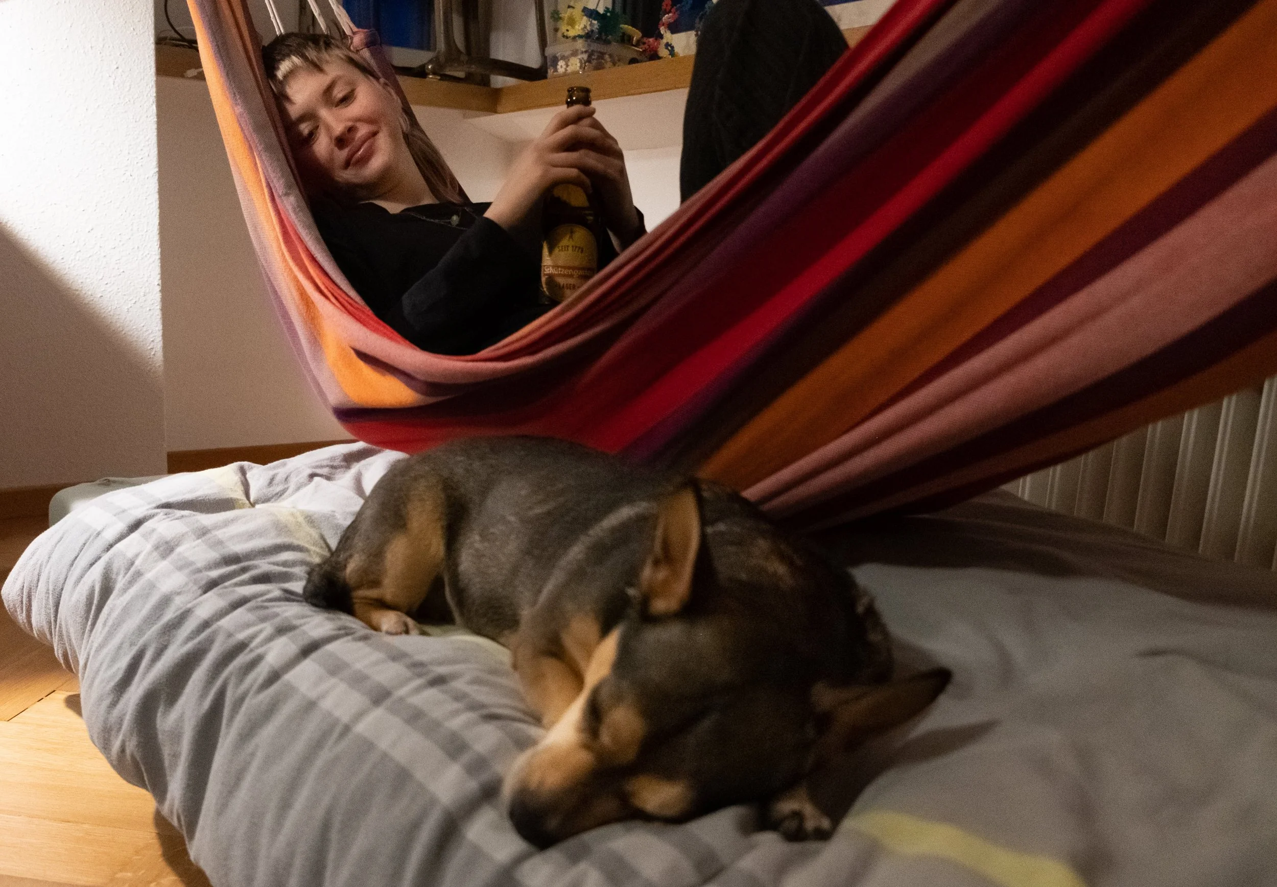 Young girl and dog lying in hangman