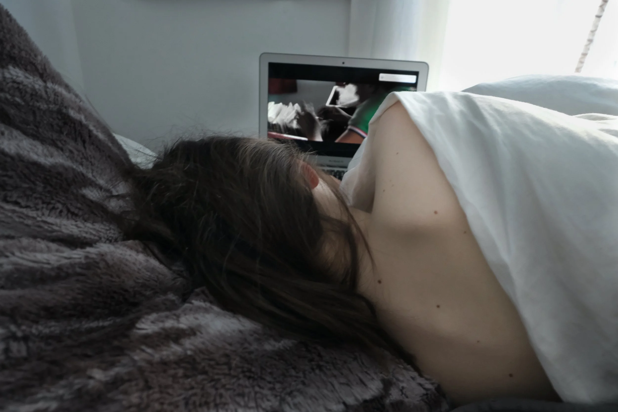 Teenage girl watching tv