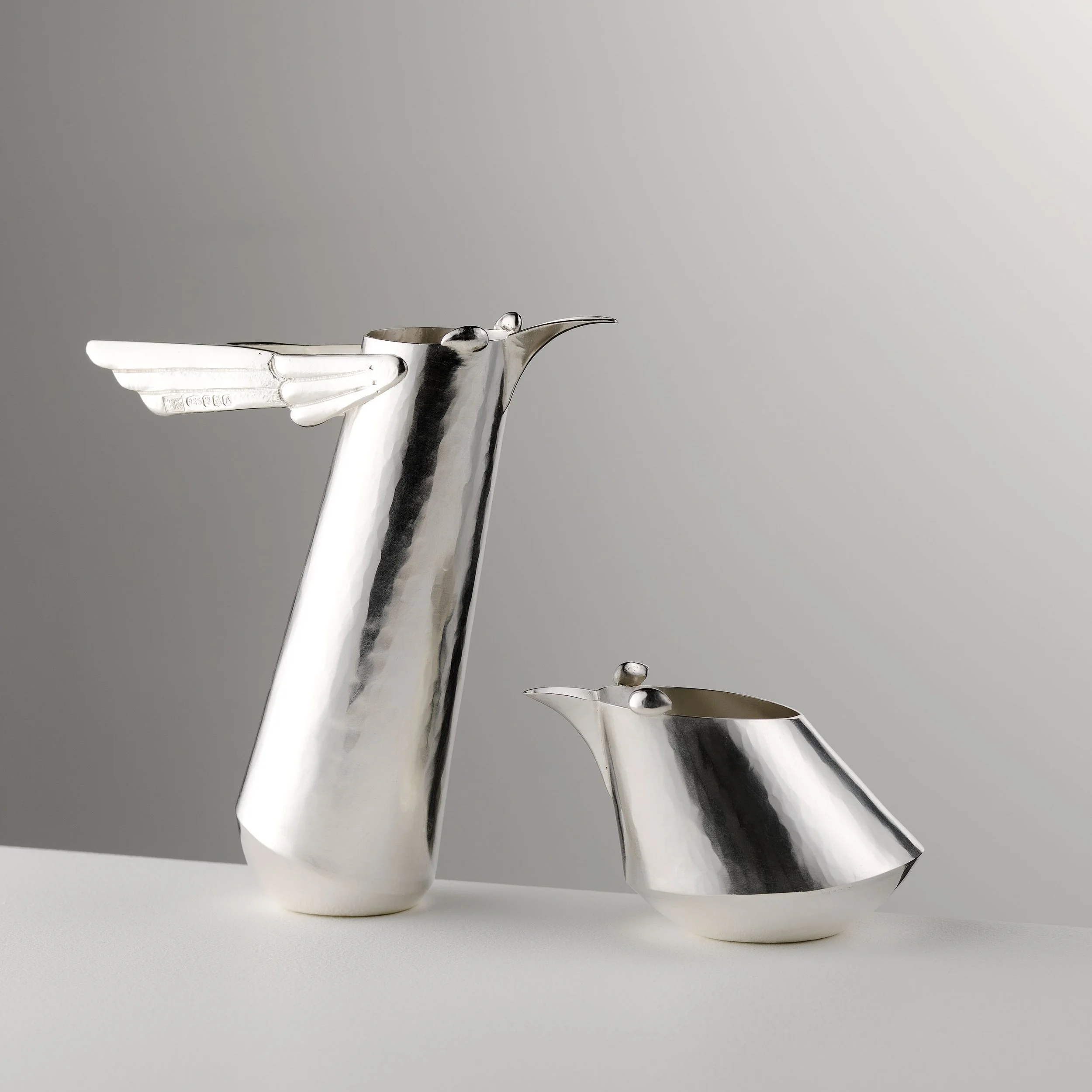 Speedy Bird Jugs. Tall and Short. Bryony Knox. silver. 13 x 10 and 8 x 8 cm. 2025. Shannon Tofts - Copy.jpg