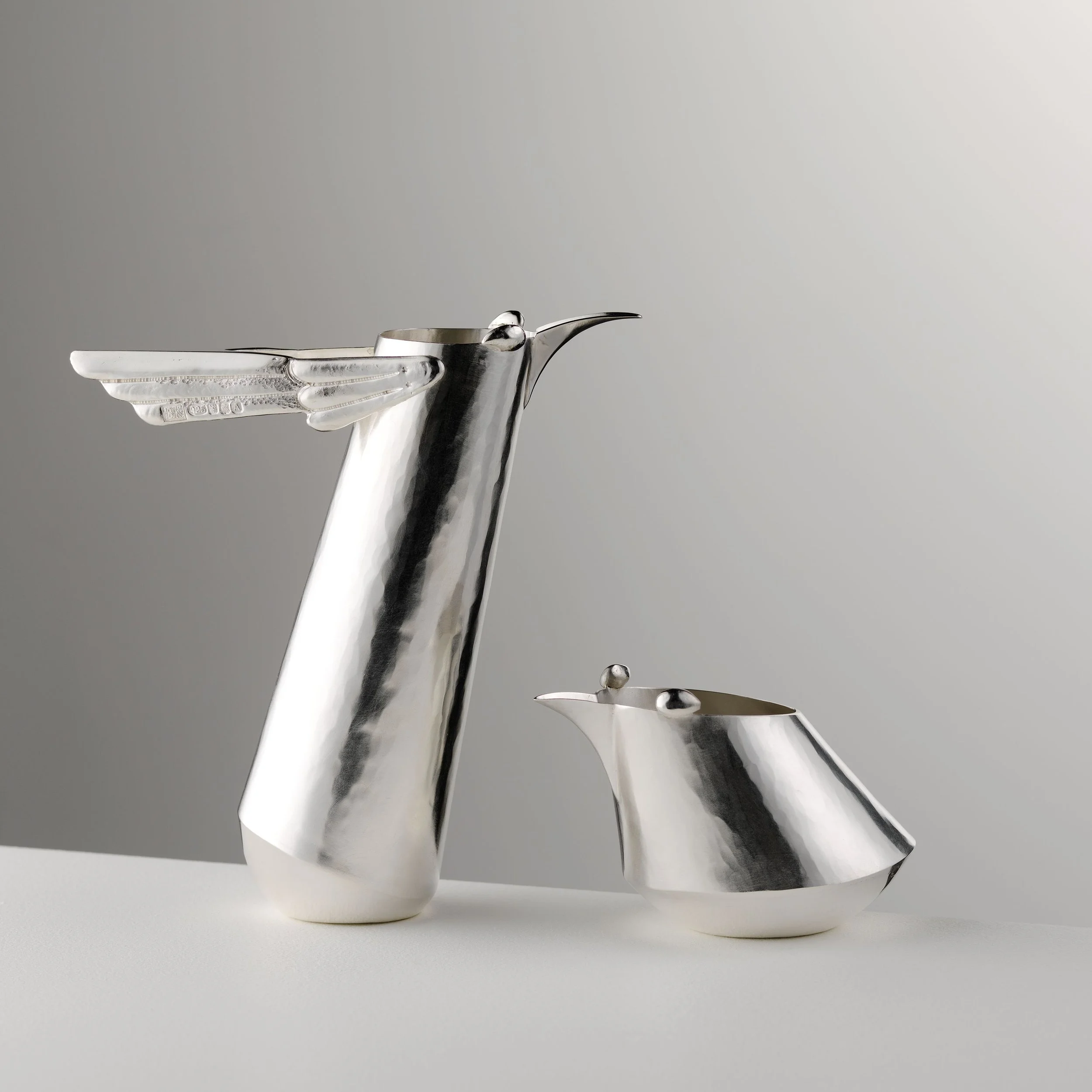 Speedy Bird Jugs. Tall and Short. Bryony Knox. silver. 13 x 10 x 3 and 8 x 8 x 8 cm. 2025. Shannon Tofts - Copy.jpg