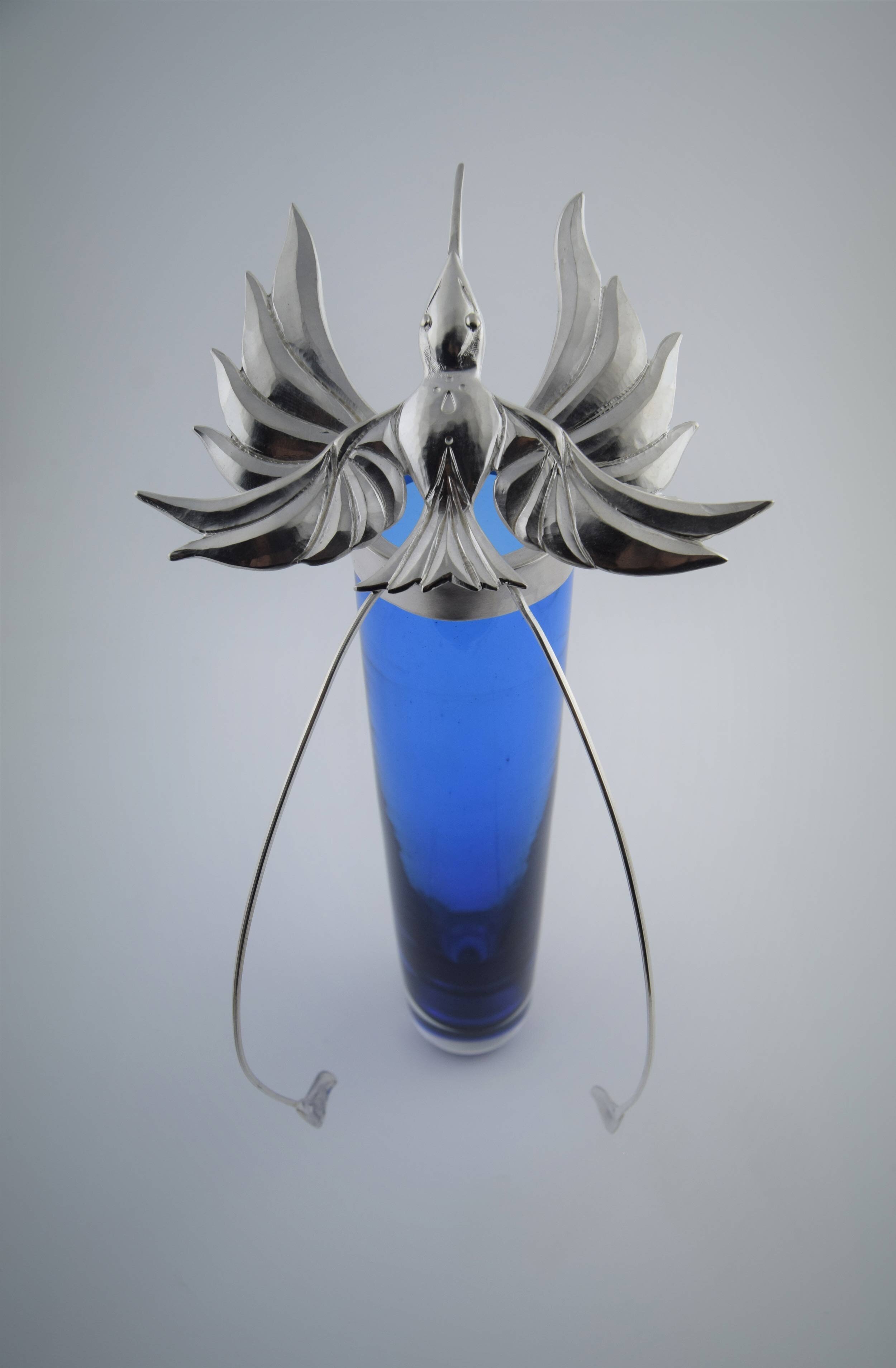 Bird in Flight, chased silver and glass