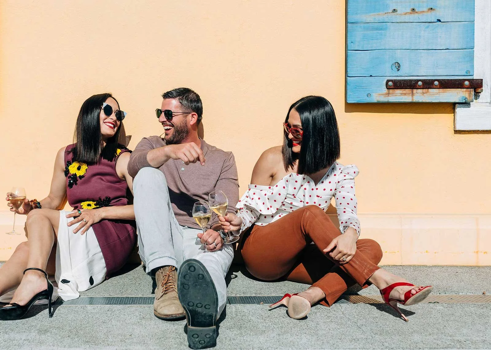 three friends drinking wine