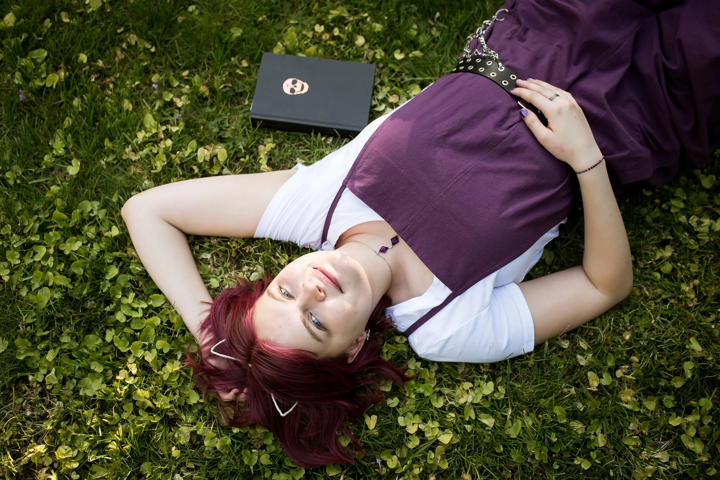  senior graduation photos tossing cap in air on campus walkway 