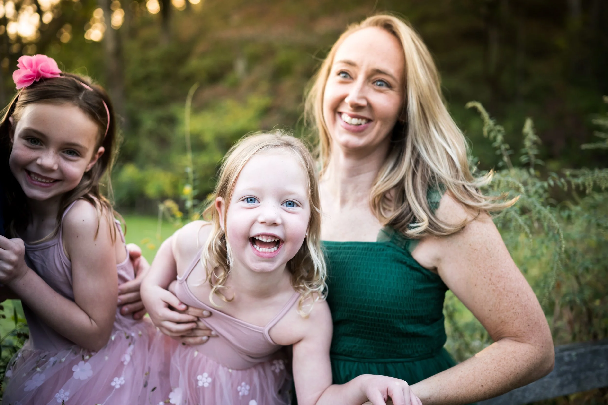 A close up photo of a family smiling during their family photoshoot