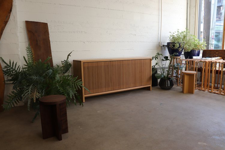 Oak Slatted Credenza in the front of the Material Studio in Portland, Oregon.