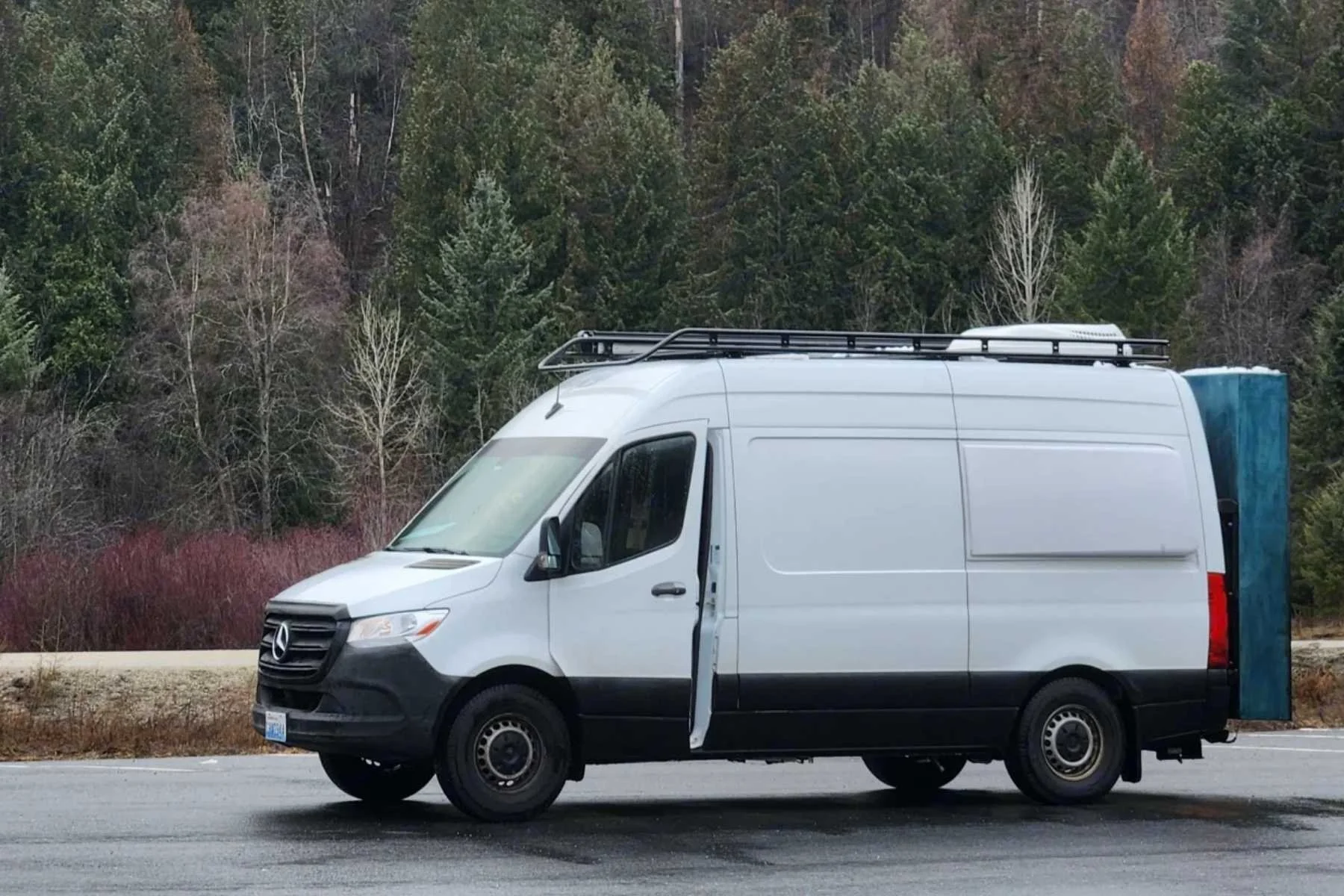 Luxury Sprinter camper van rental in Bend, Oregon featuring wet bath, rear gear storage, and premium interior